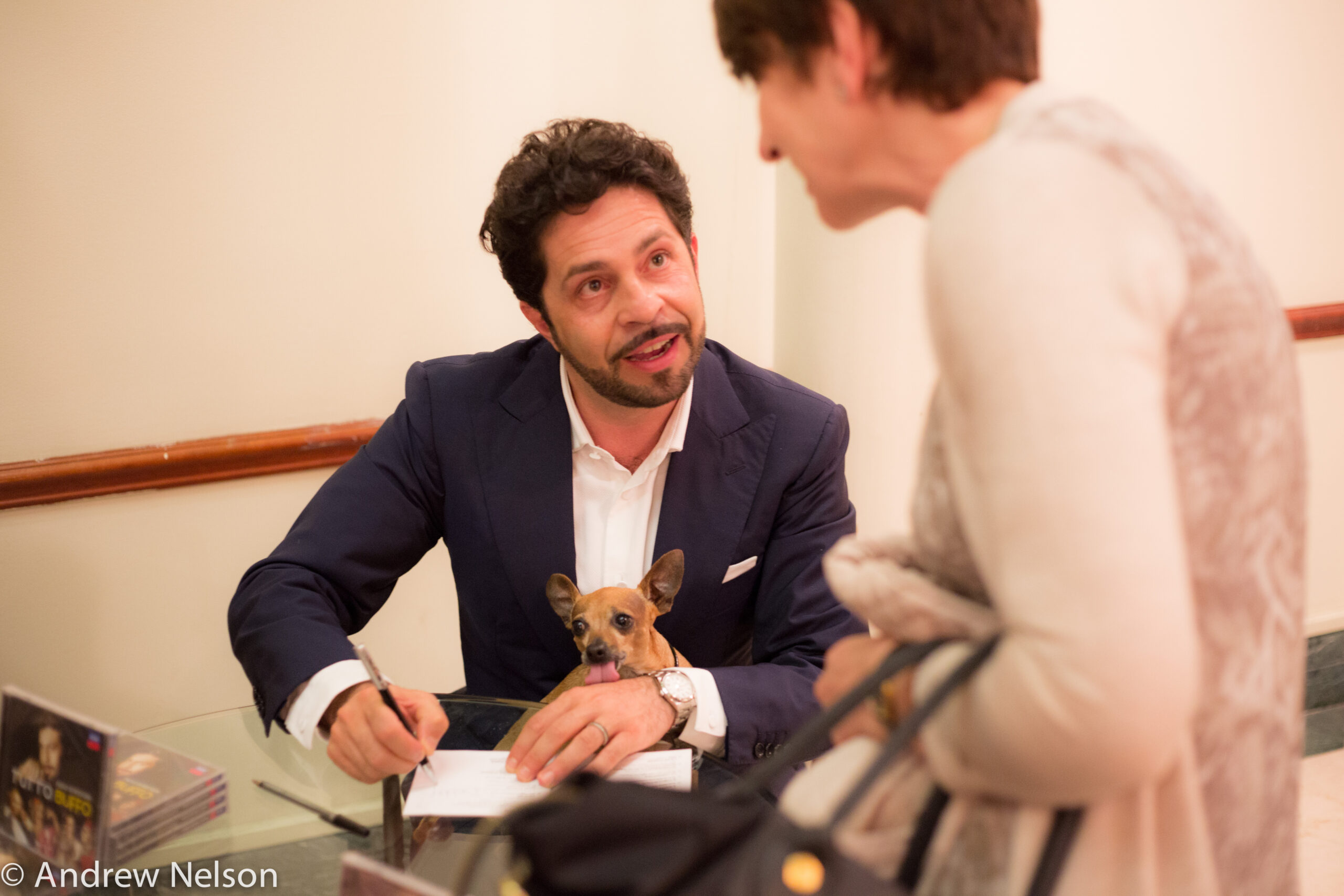 artist-signing-book-from-rossini-opera-festival-at-casa-italiana