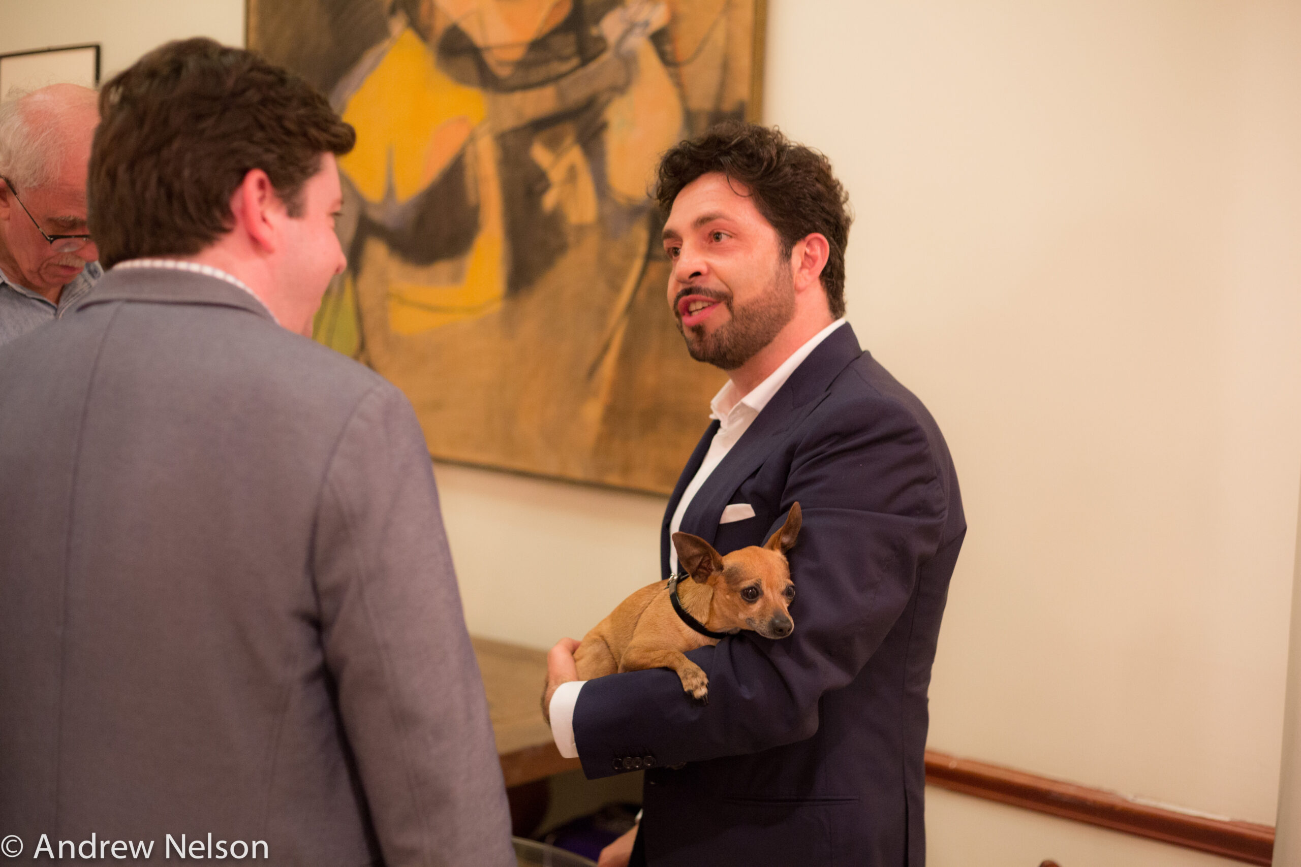 two-men-conversing-from-rossini-opera-festival-at-casa-italiana