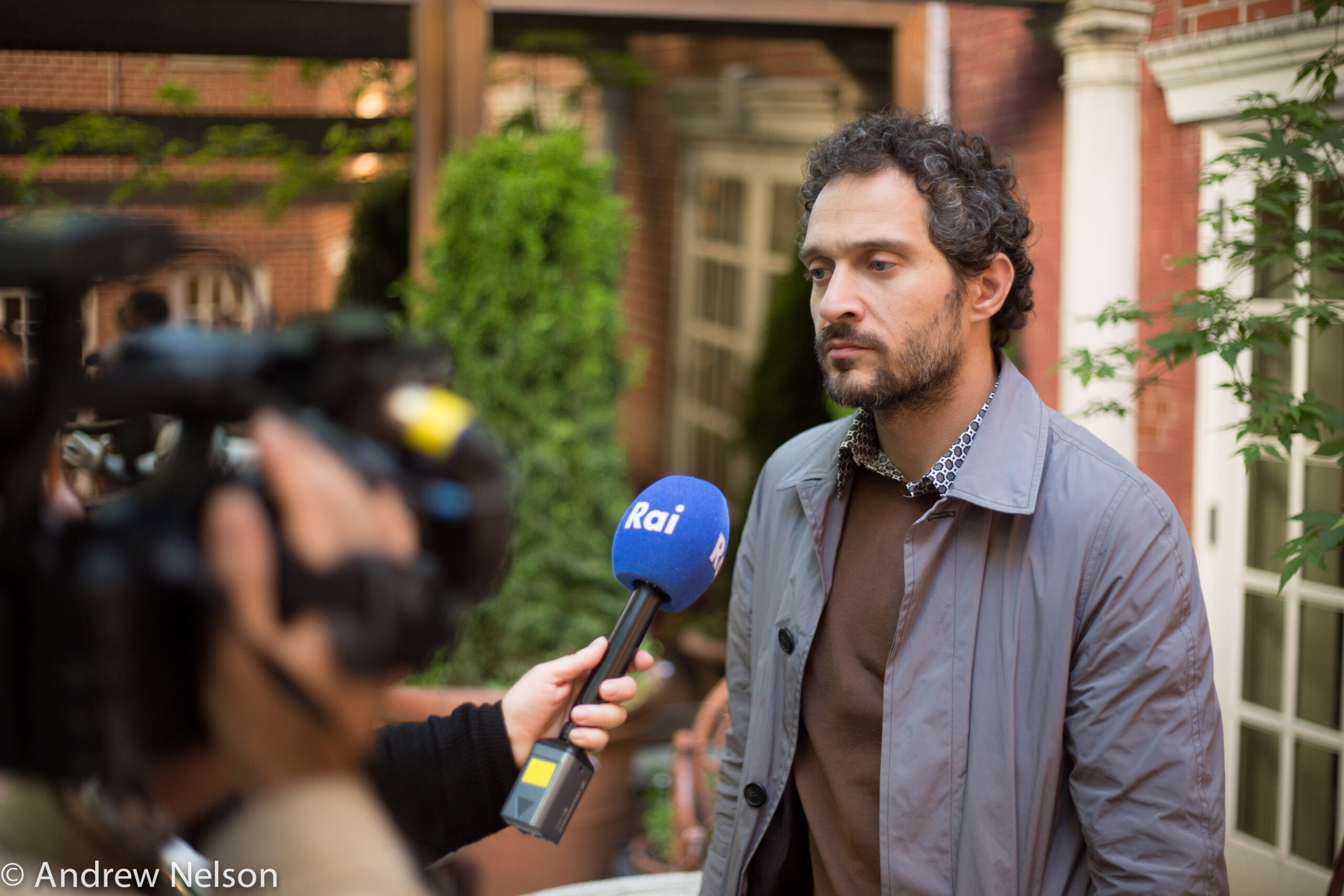 man-being-interviewed-from-round-table-open-roads-2015-at-casa-italiana