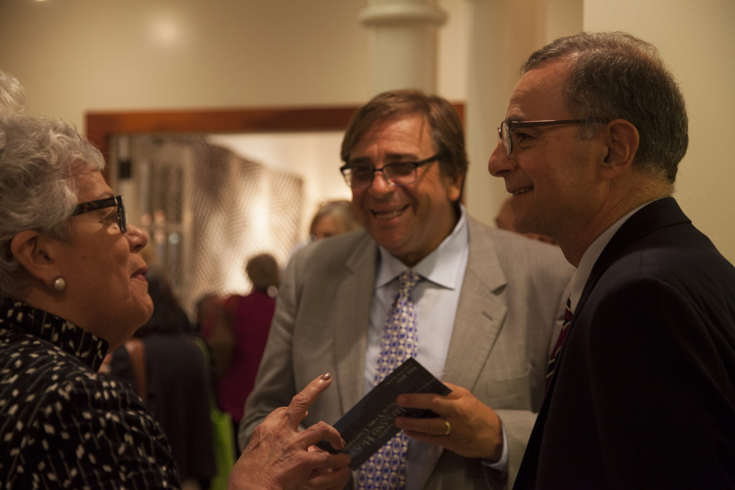 author-talking-to-guests-from-book-presentation-an-unlikely-union-at-casa-italiana