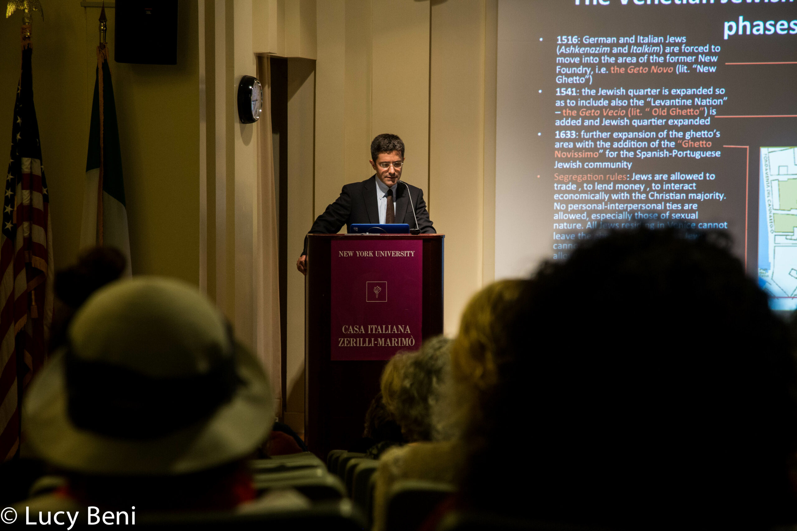 speaker-talking-and-projector-screen-from-the-ghetto-to-cappella-at-casa-italiana