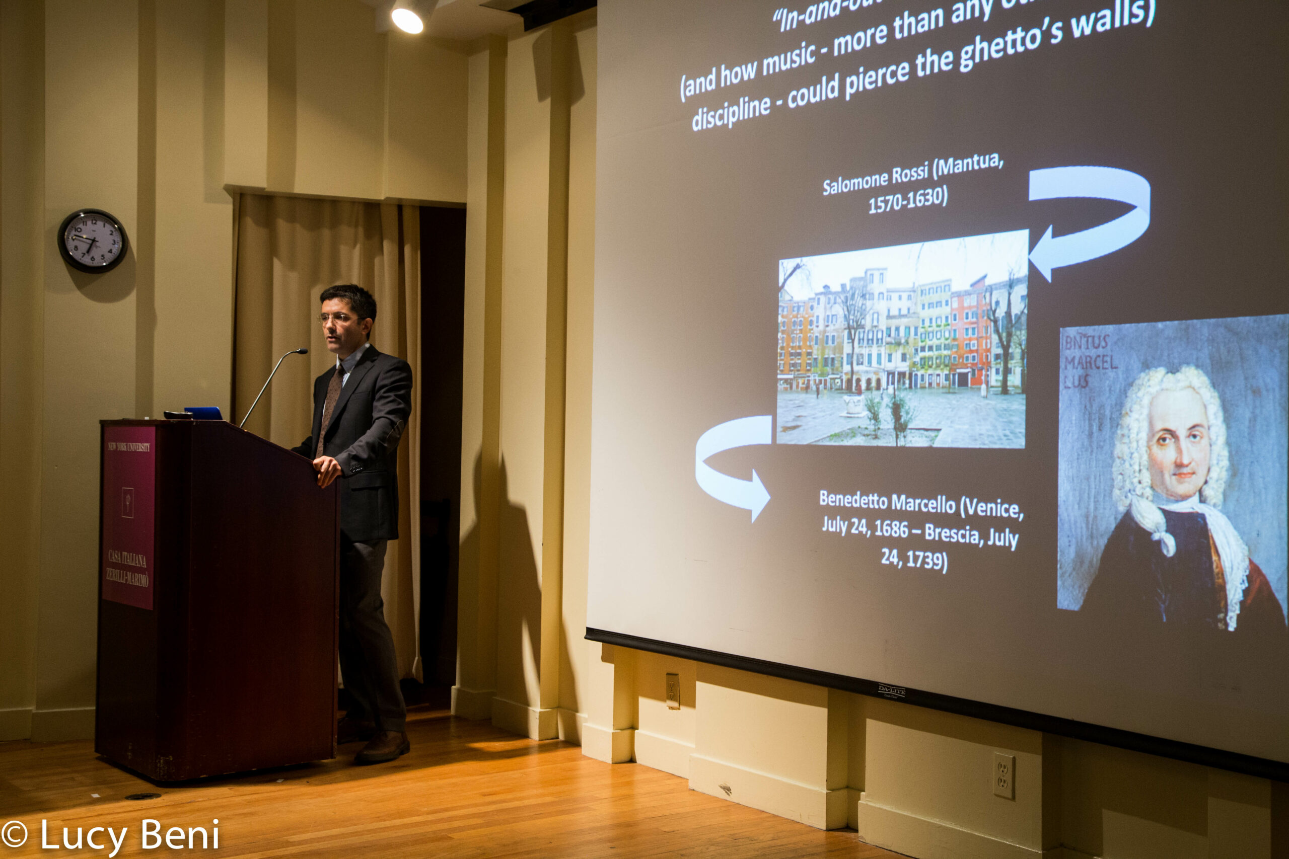 speaker-talking-and-projector-screen-from-the-ghetto-to-cappella-at-casa-italiana