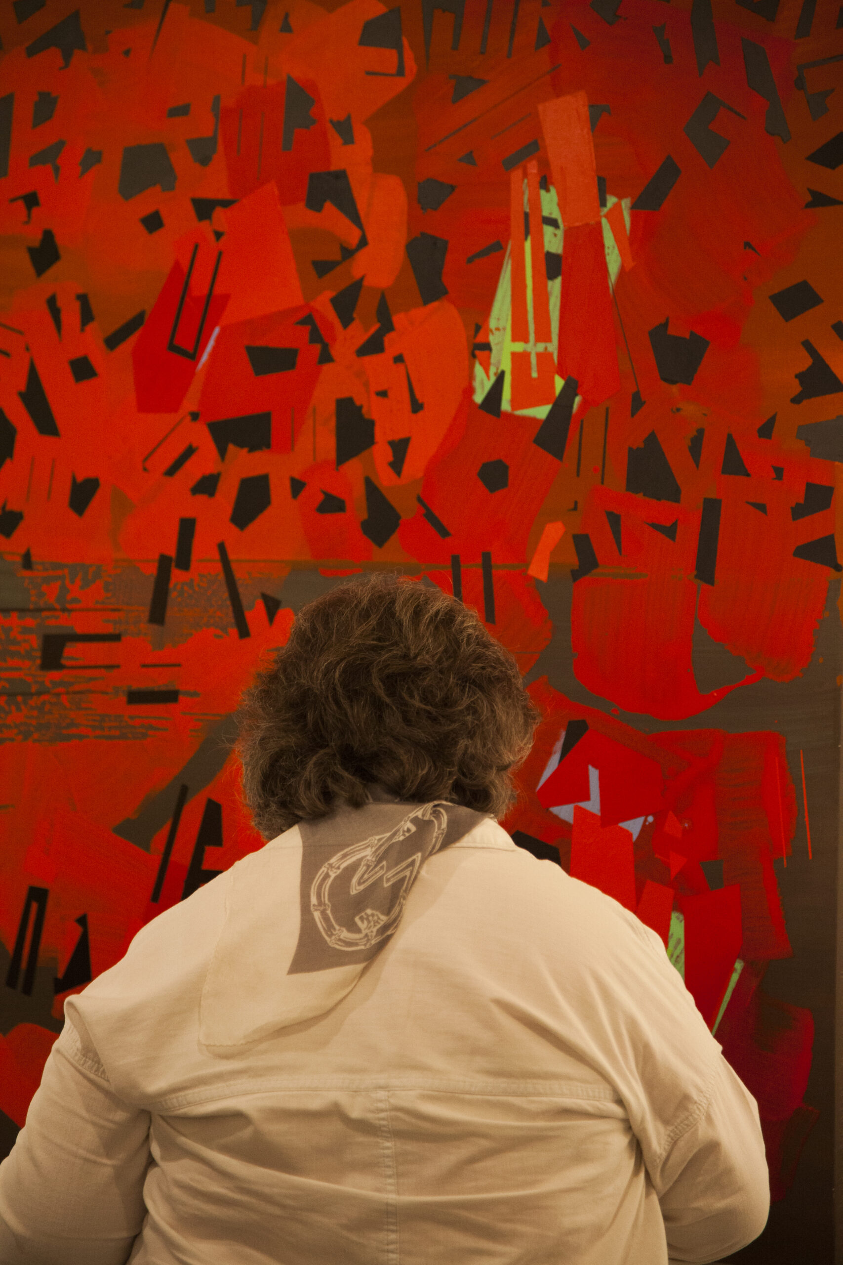 lady-seeing-artwork-from-diffraction-exhibition-opening-and-the-fat-man-arpeggios-book-pres-at-casa-italiana