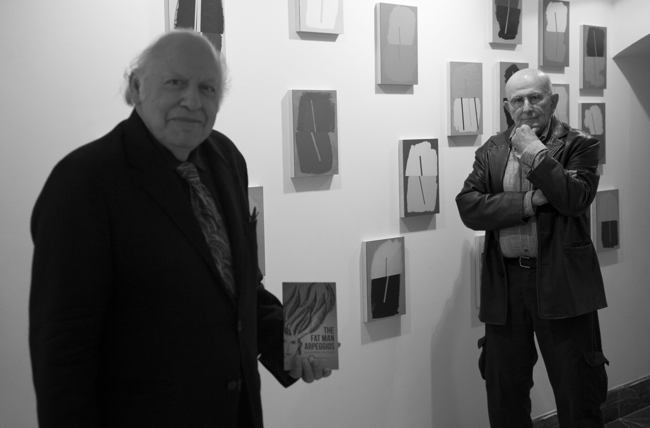 authors-with-book-and-artworks-on-wall-from-diffraction-exhibition-opening-and-the-fat-man-arpeggios-book-pres-at-casa-italiana