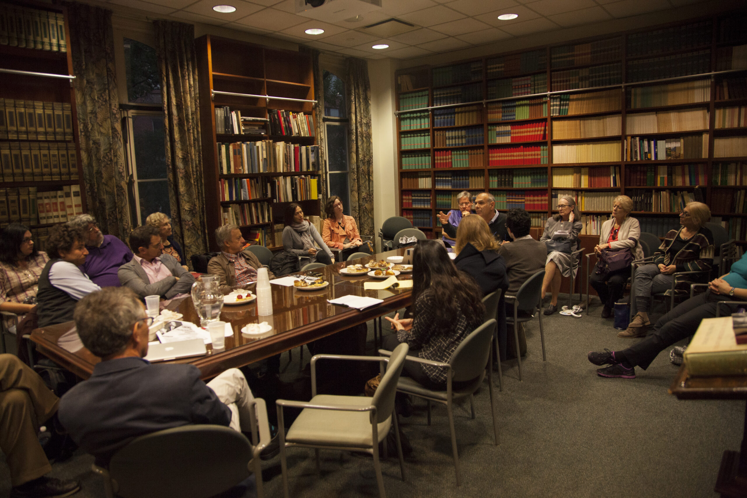 speaker-talking-with-guests-from-leopardi-at-casa-italiana