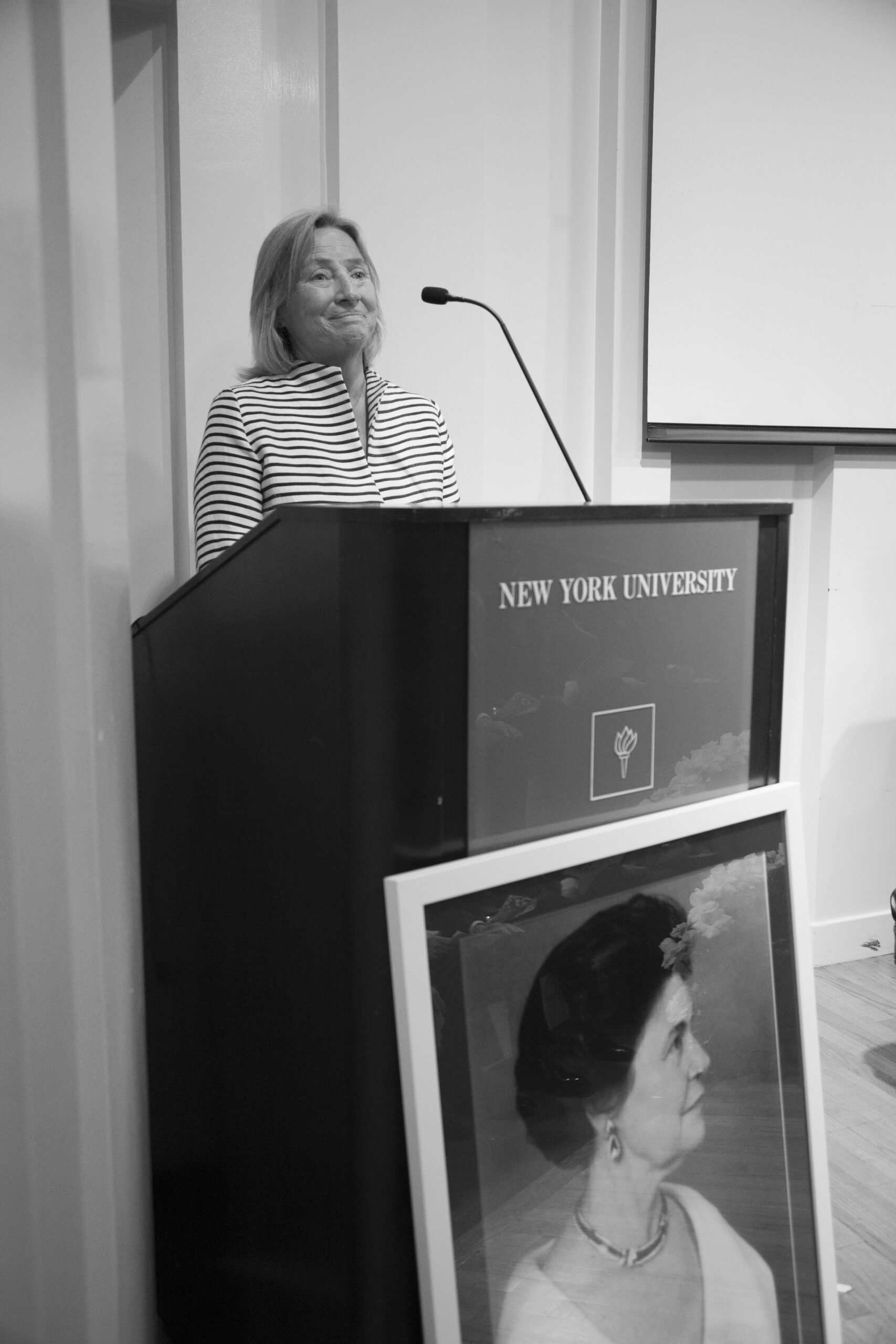 speaker-talking-from-a-tribute-in-words-and-music-for-baroness-mariuccia-zerilli-marim-at-casa-italiana