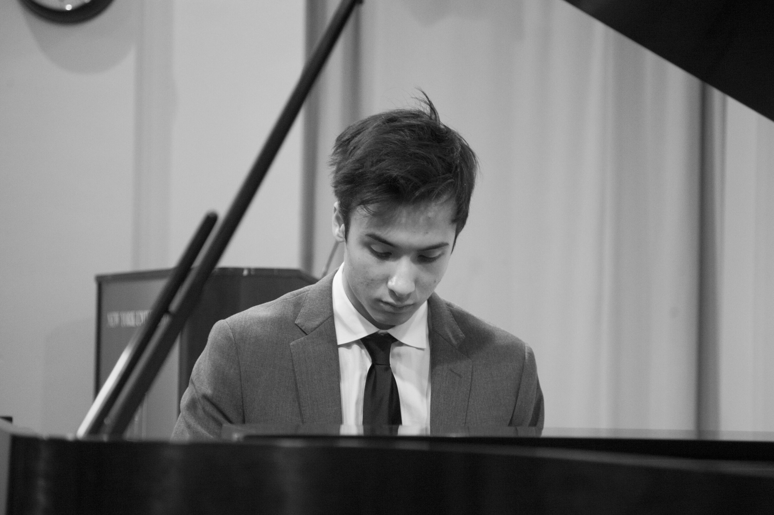 musician-playing-piano-from-a-tribute-in-words-and-music-for-baroness-mariuccia-zerilli-marim-at-casa-italiana