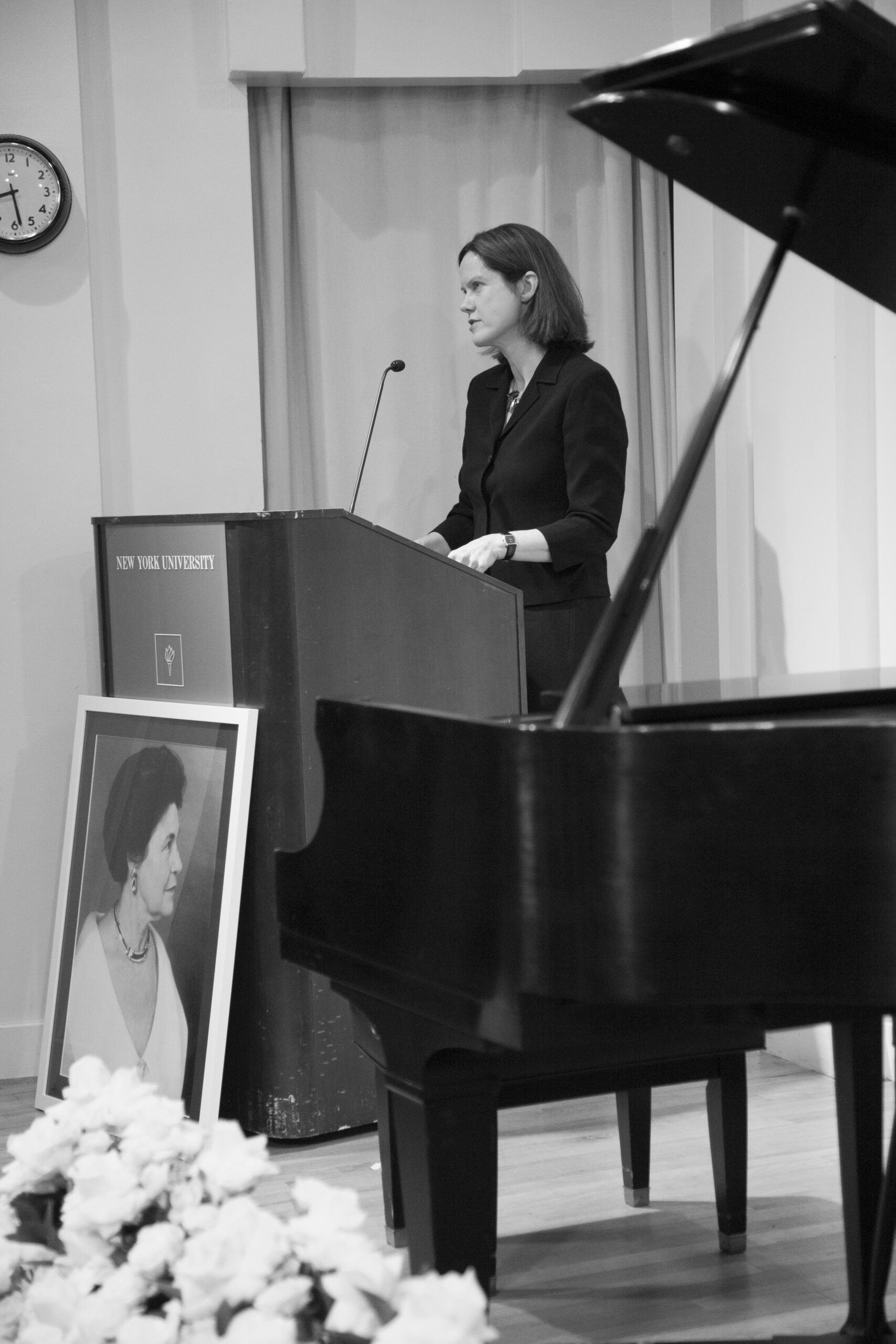 speaker-talking-from-a-tribute-in-words-and-music-for-baroness-mariuccia-zerilli-marim-at-casa-italiana