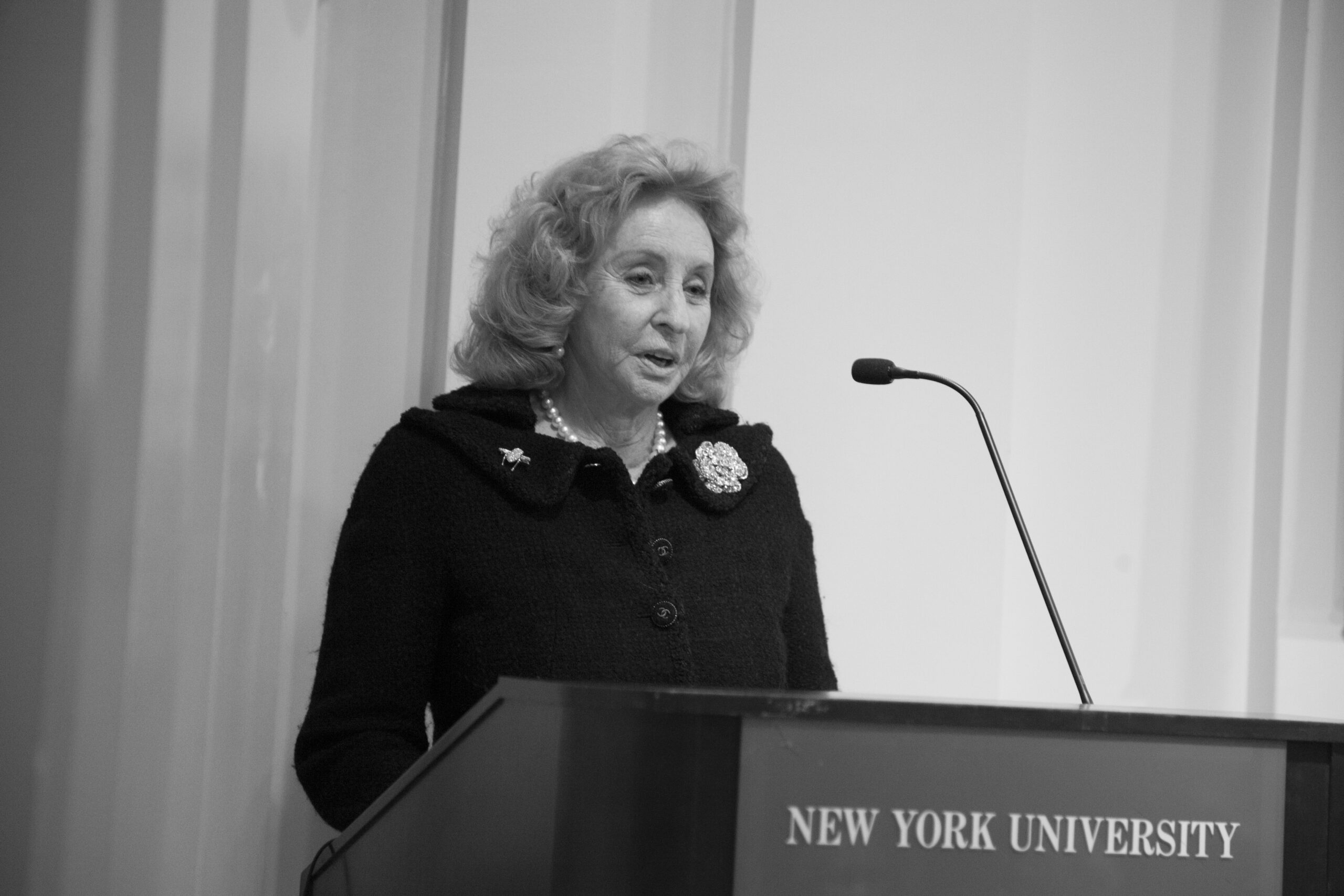 speaker-talking-from-a-tribute-in-words-and-music-for-baroness-mariuccia-zerilli-marim-at-casa-italiana