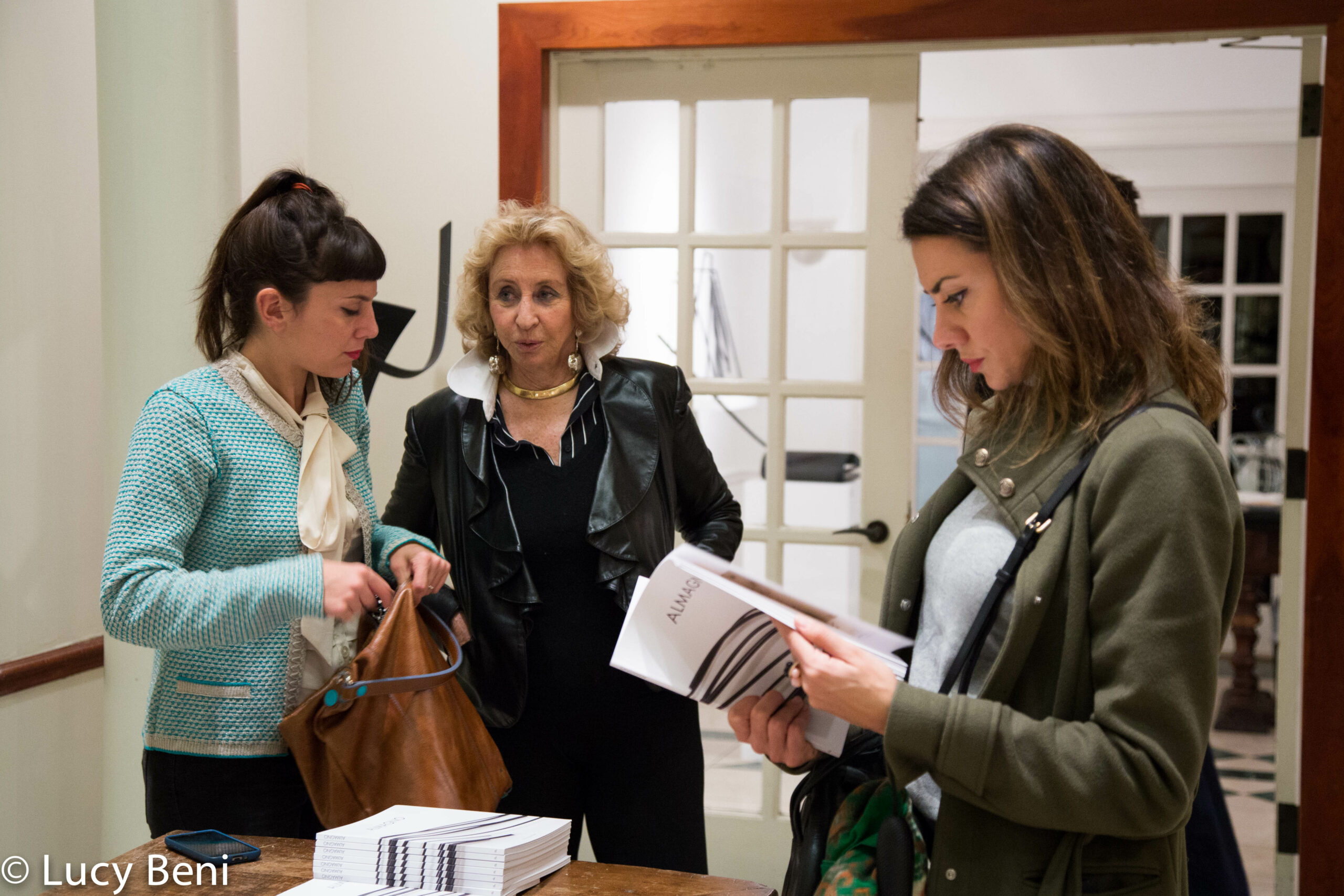 lady-seeing-the-book-from-exhibiton-opening-works-by-roberto-almagno-at-casa-italiana