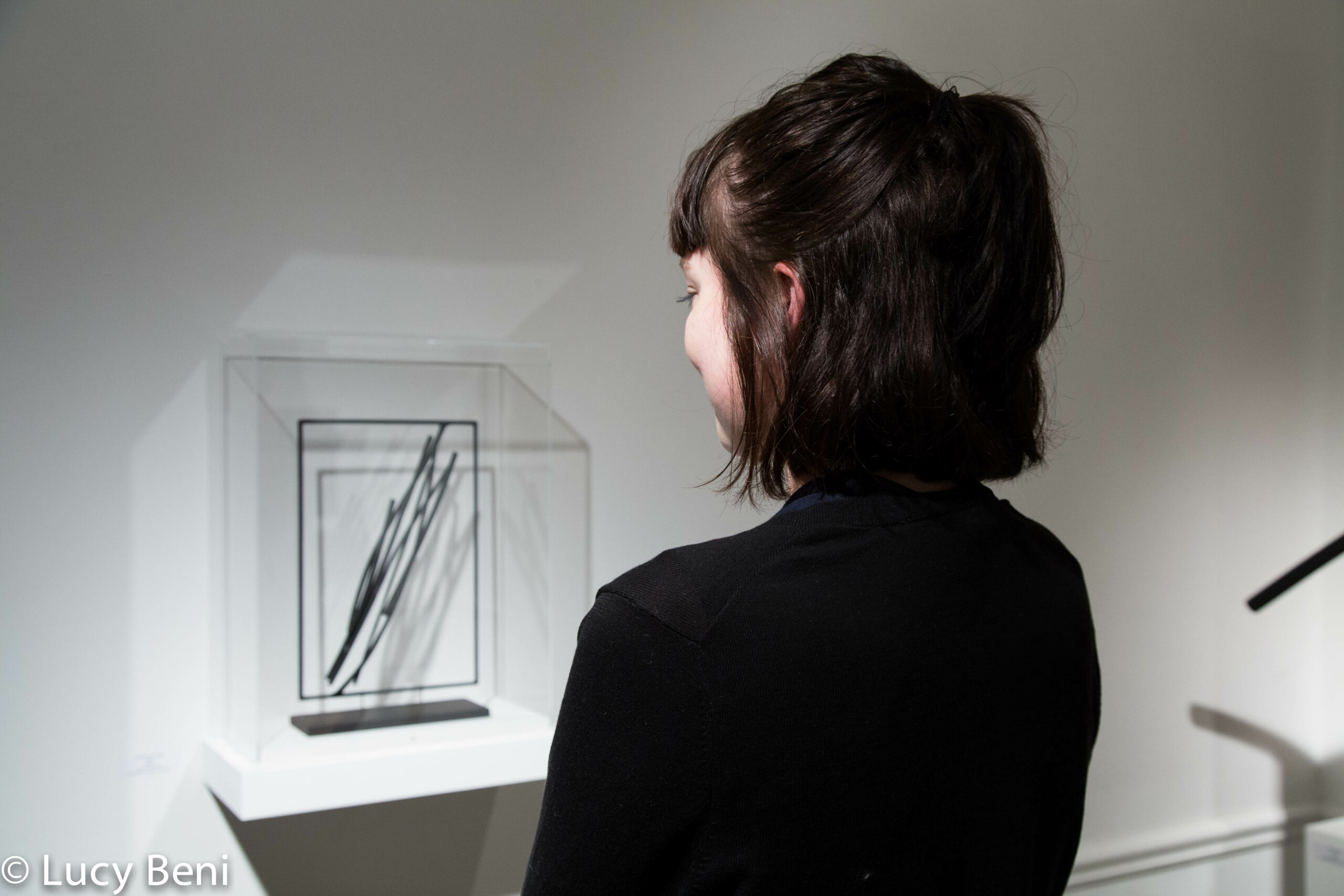 girl-looking-at-artwork-from-exhibiton-opening-works-by-roberto-almagno-at-casa-italiana