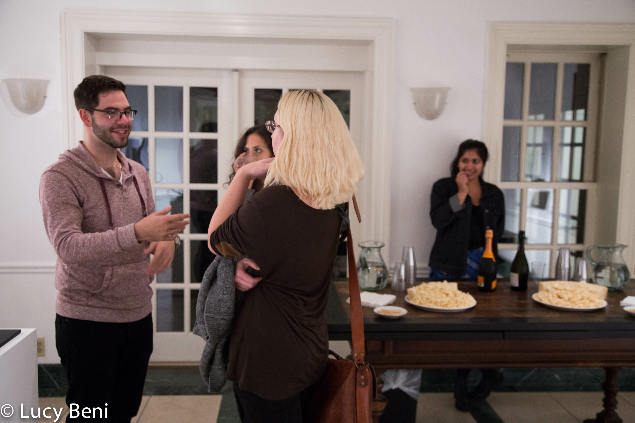 people-interacting-from-exhibiton-opening-works-by-roberto-almagno-at-casa-italiana