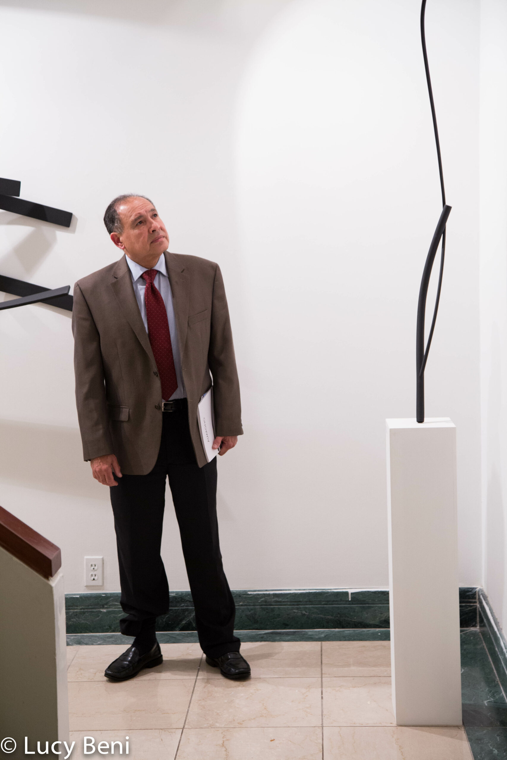 man-seeing-artwork-from-exhibiton-opening-works-by-roberto-almagno-at-casa-italiana