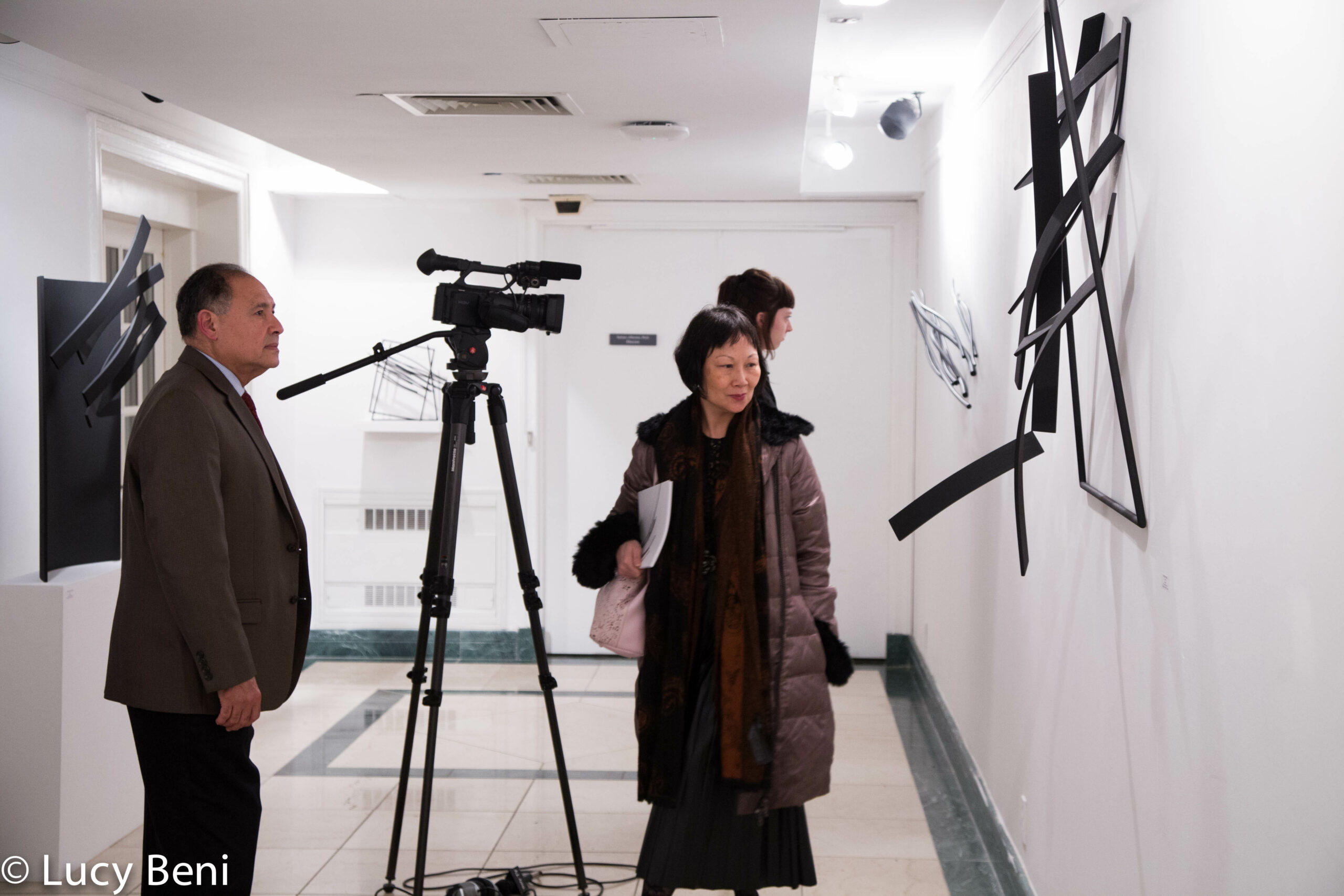 camera-and-people-seeing-exhibit-from-exhibiton-opening-works-by-roberto-almagno-at-casa-italiana