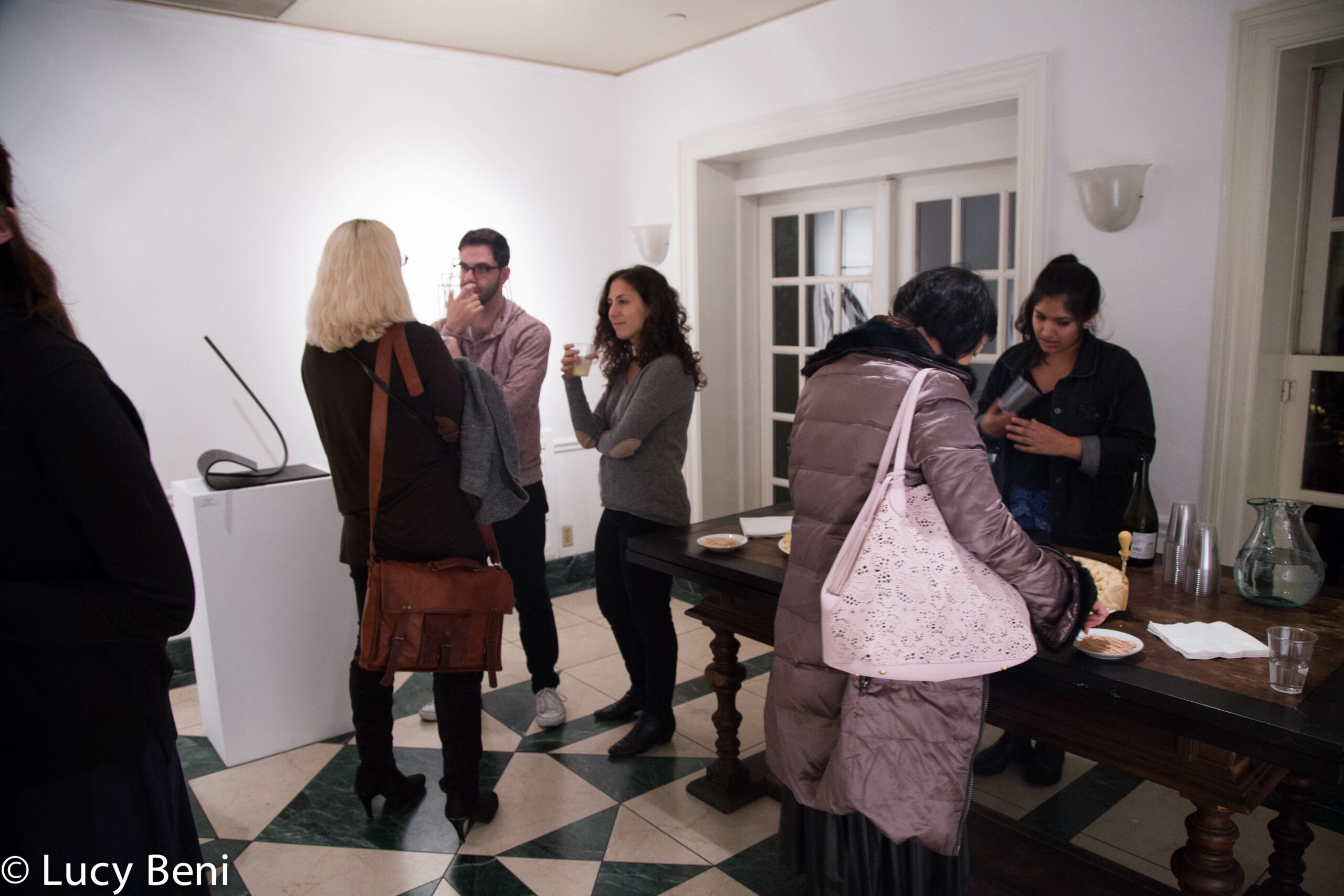 people-interacting-from-exhibiton-opening-works-by-roberto-almagno-at-casa-italiana