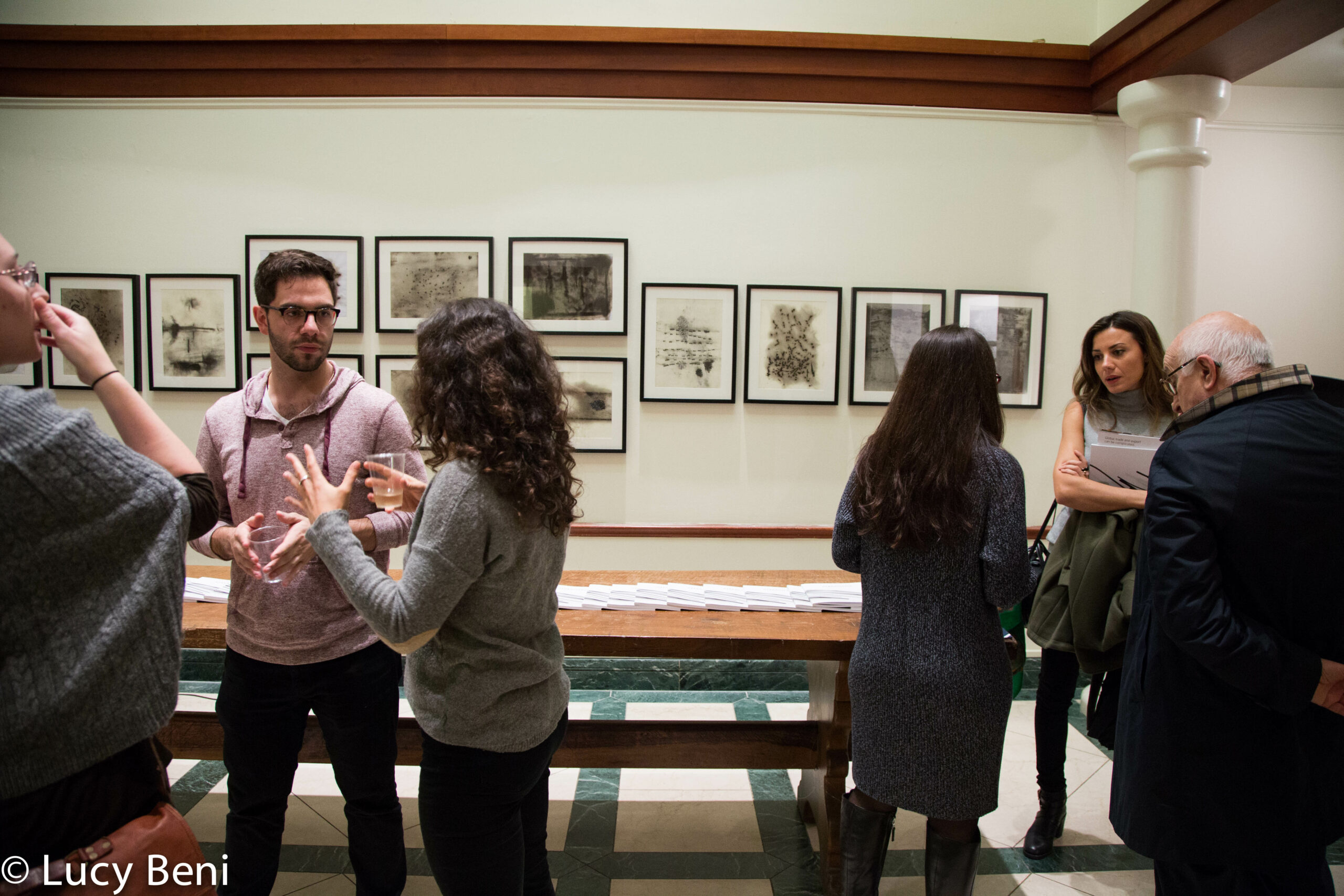 people-interacting-from-exhibiton-opening-works-by-roberto-almagno-at-casa-italiana