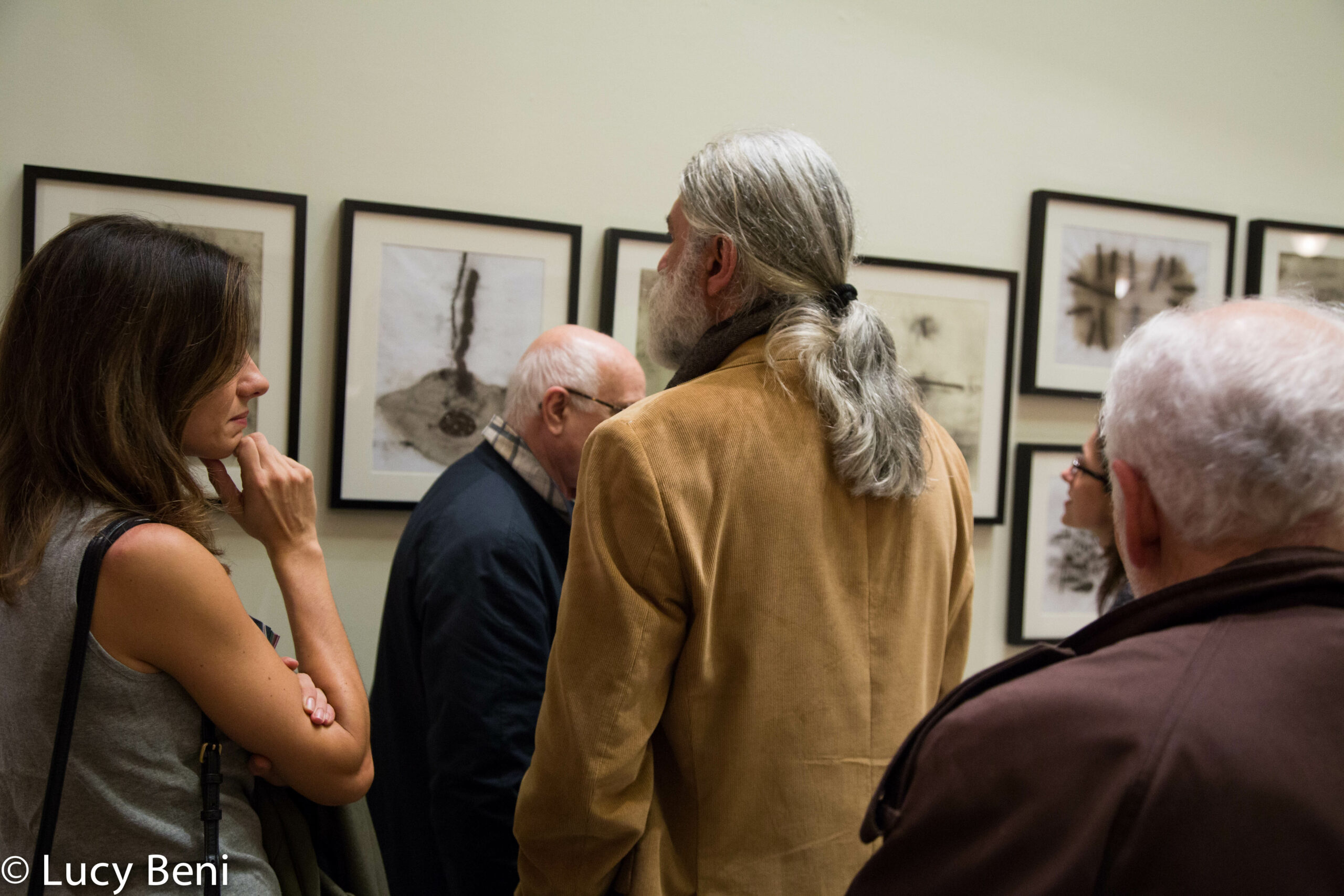 people-seeing-exhibit-from-exhibiton-opening-works-by-roberto-almagno-at-casa-italiana