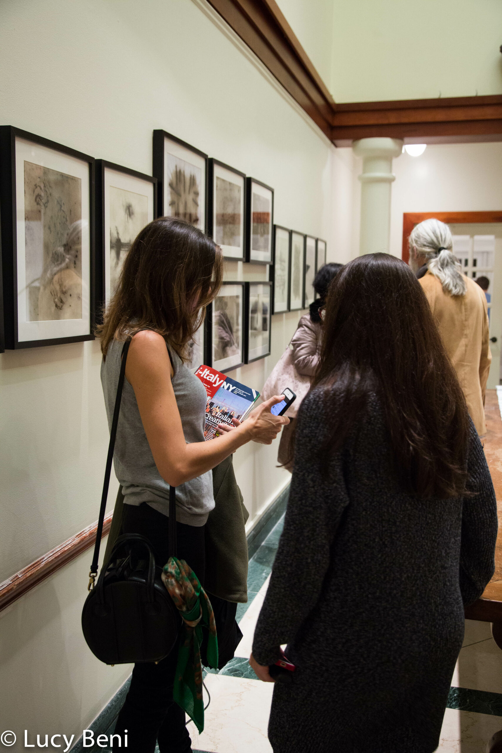 people-interacting-from-exhibiton-opening-works-by-roberto-almagno-at-casa-italiana