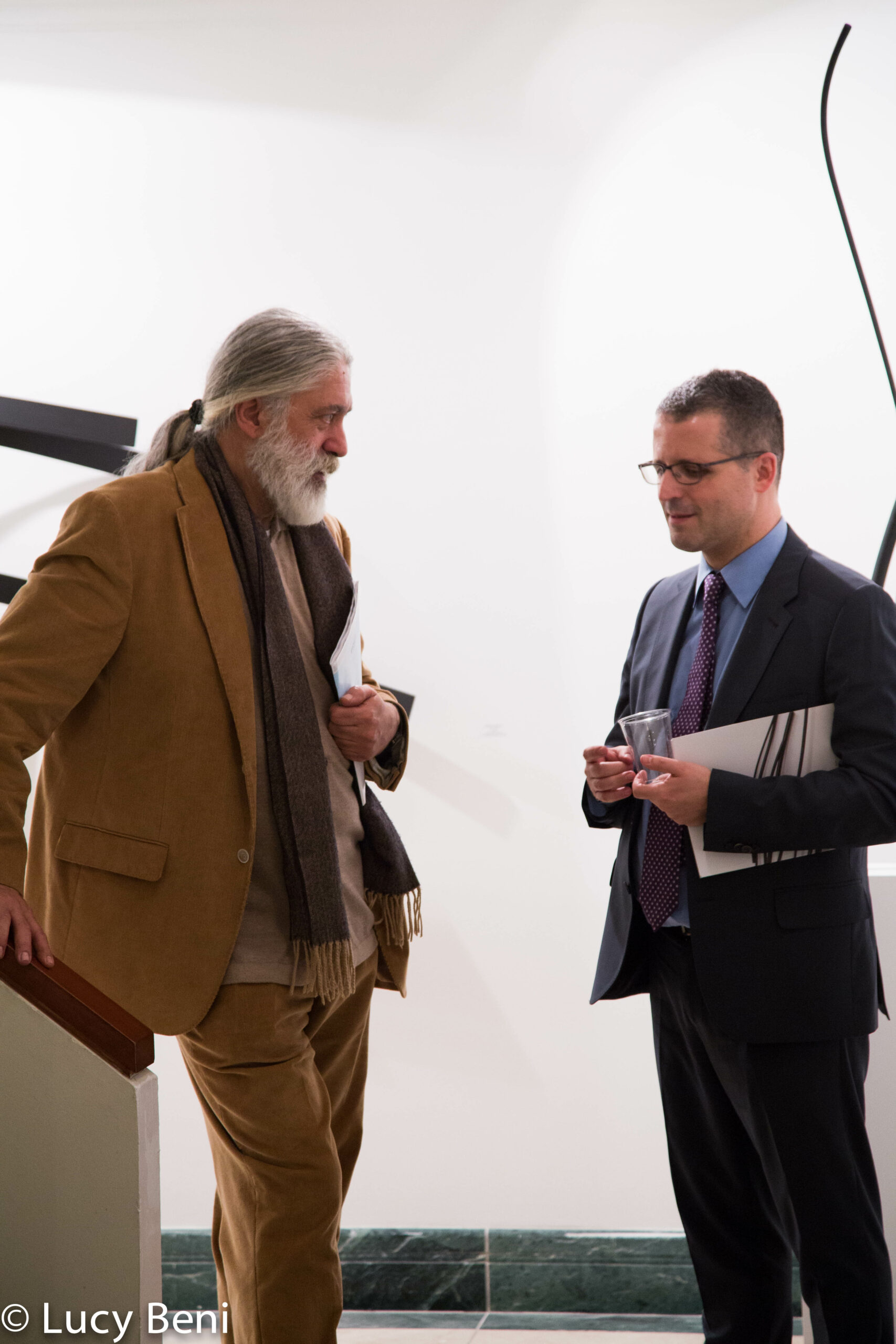 artist-talking-to-man-from-exhibiton-opening-works-by-roberto-almagno-at-casa-italiana