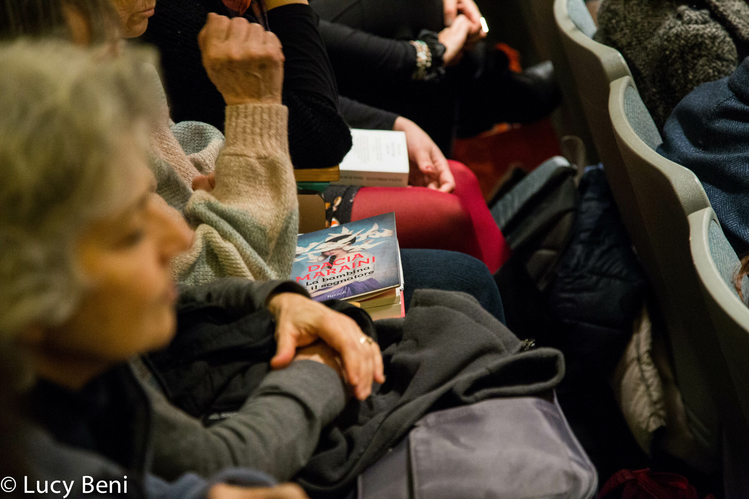 spectators-with-book-from-a-conversation-with-dacia-maraini-at-casa-italiana