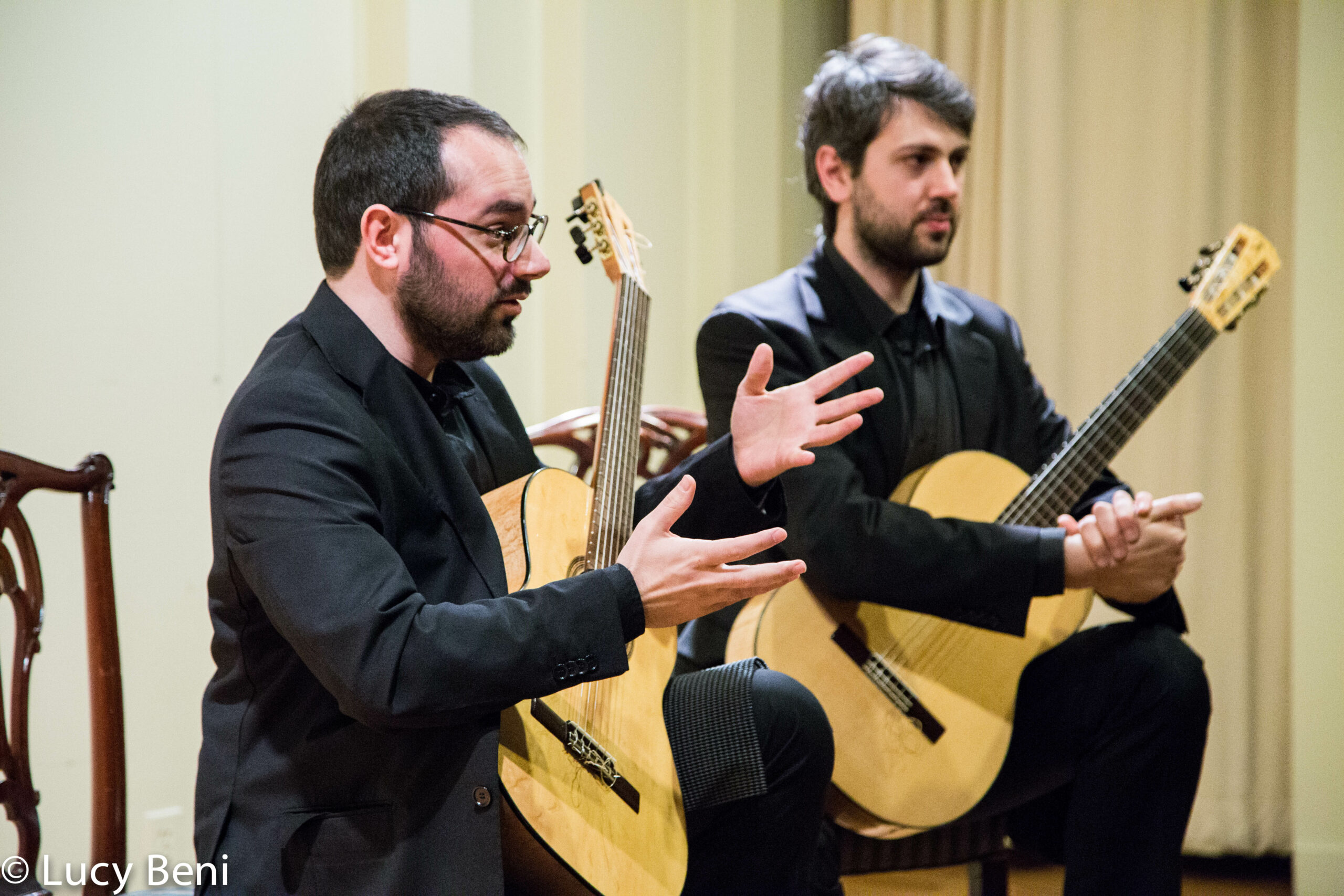 musician-talking-from-concert-duo-scarlatti-guitar-duo-at-casa-italiana