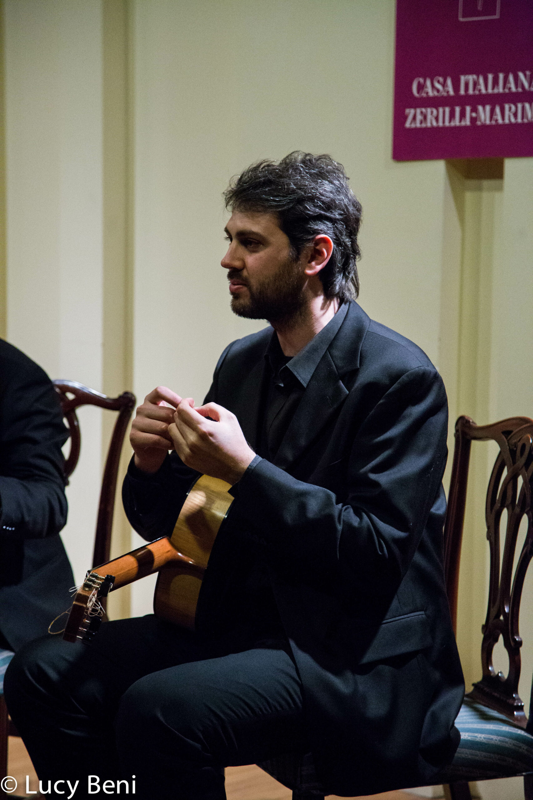 musician-talking-from-concert-duo-scarlatti-guitar-duo-at-casa-italiana