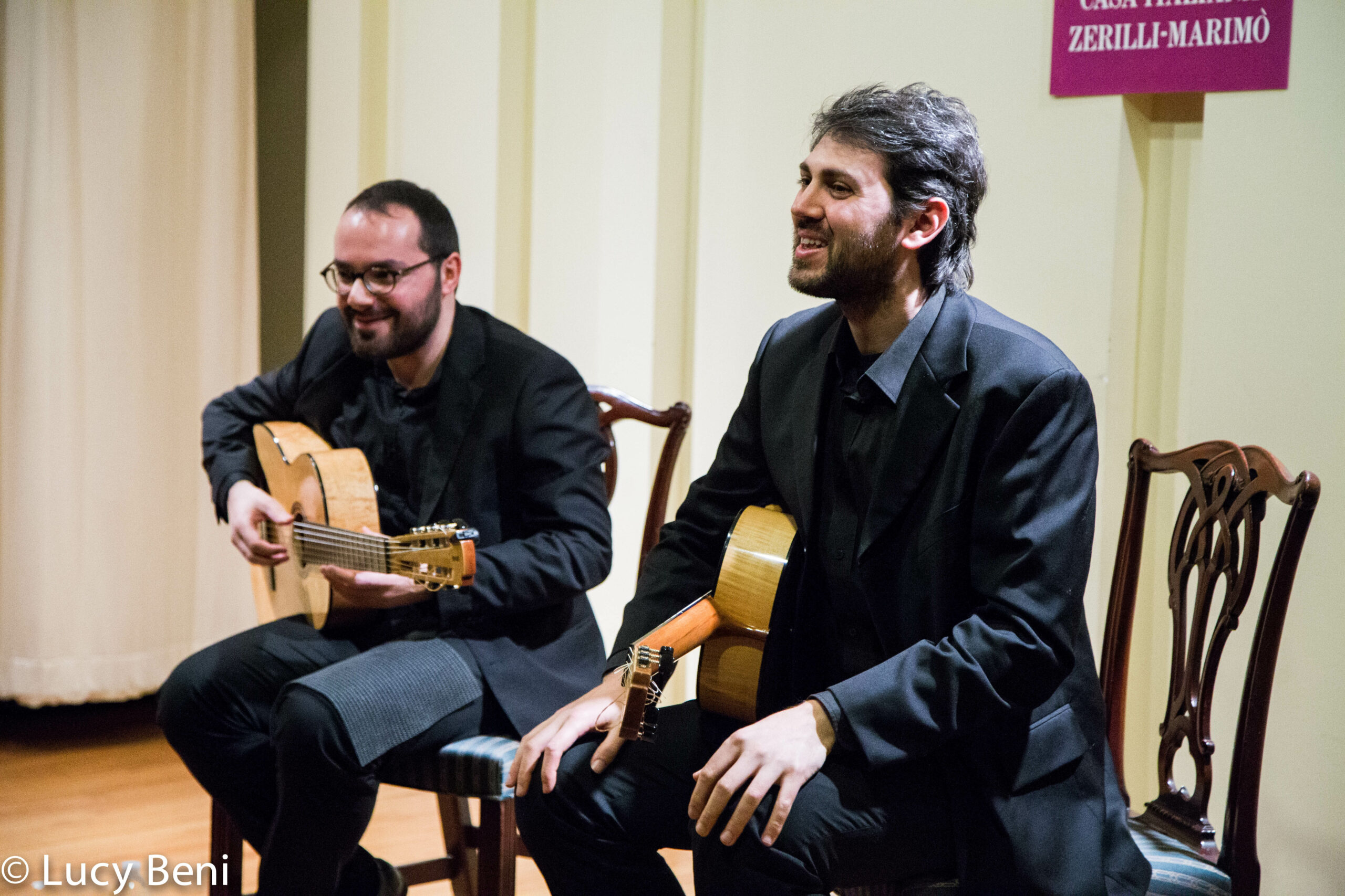 musician-playing-guitar-from-concert-duo-scarlatti-guitar-duo-at-casa-italiana
