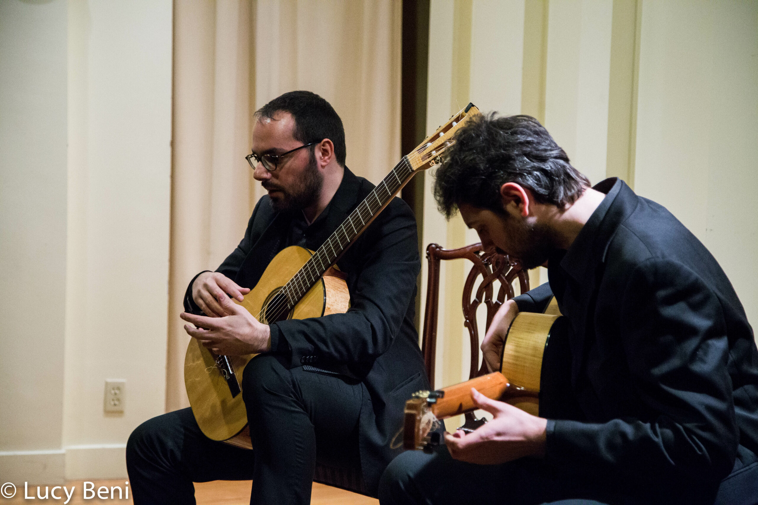 musician-playing-guitar-from-concert-duo-scarlatti-guitar-duo-at-casa-italiana