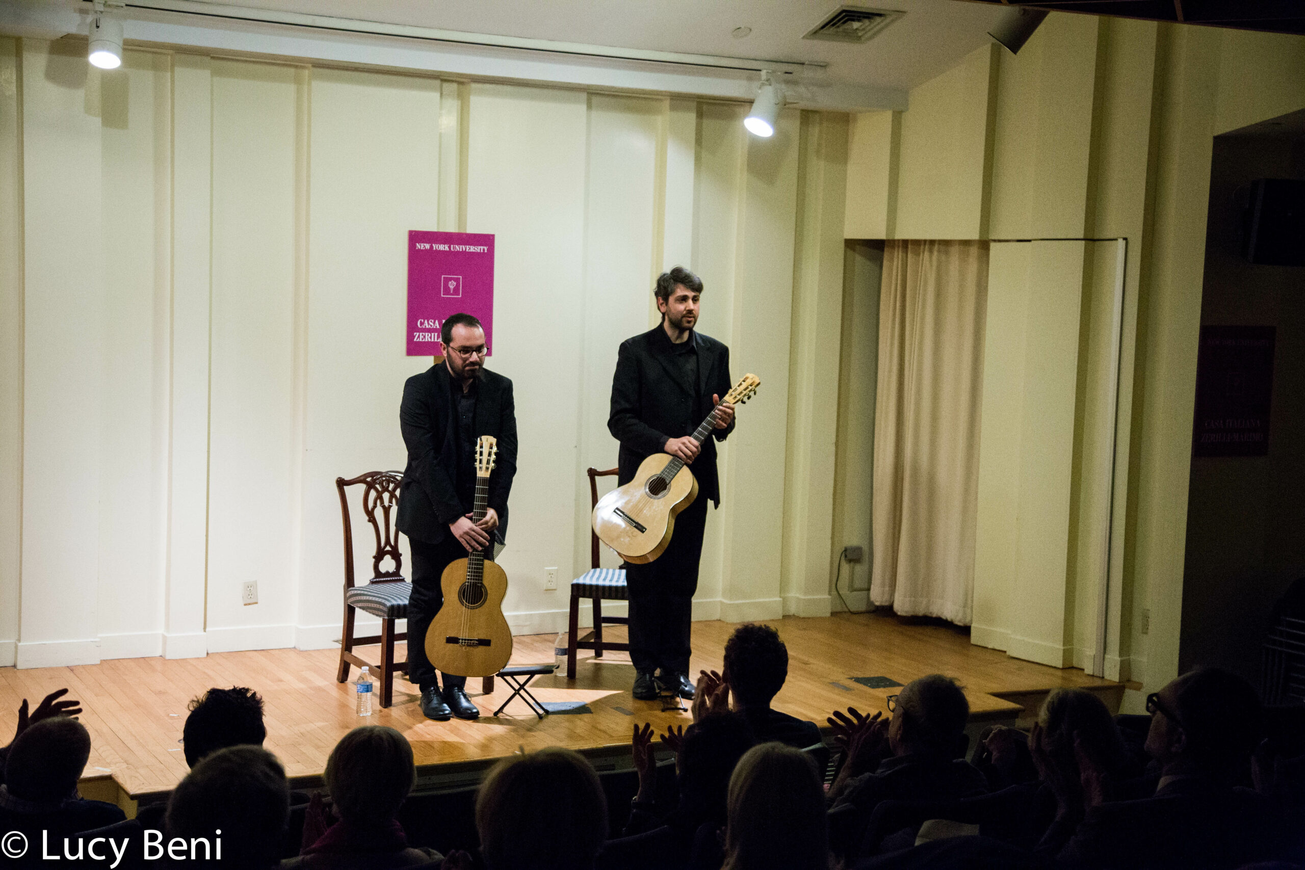 musician-standing-with-guitar-from-concert-duo-scarlatti-guitar-duo-at-casa-italiana