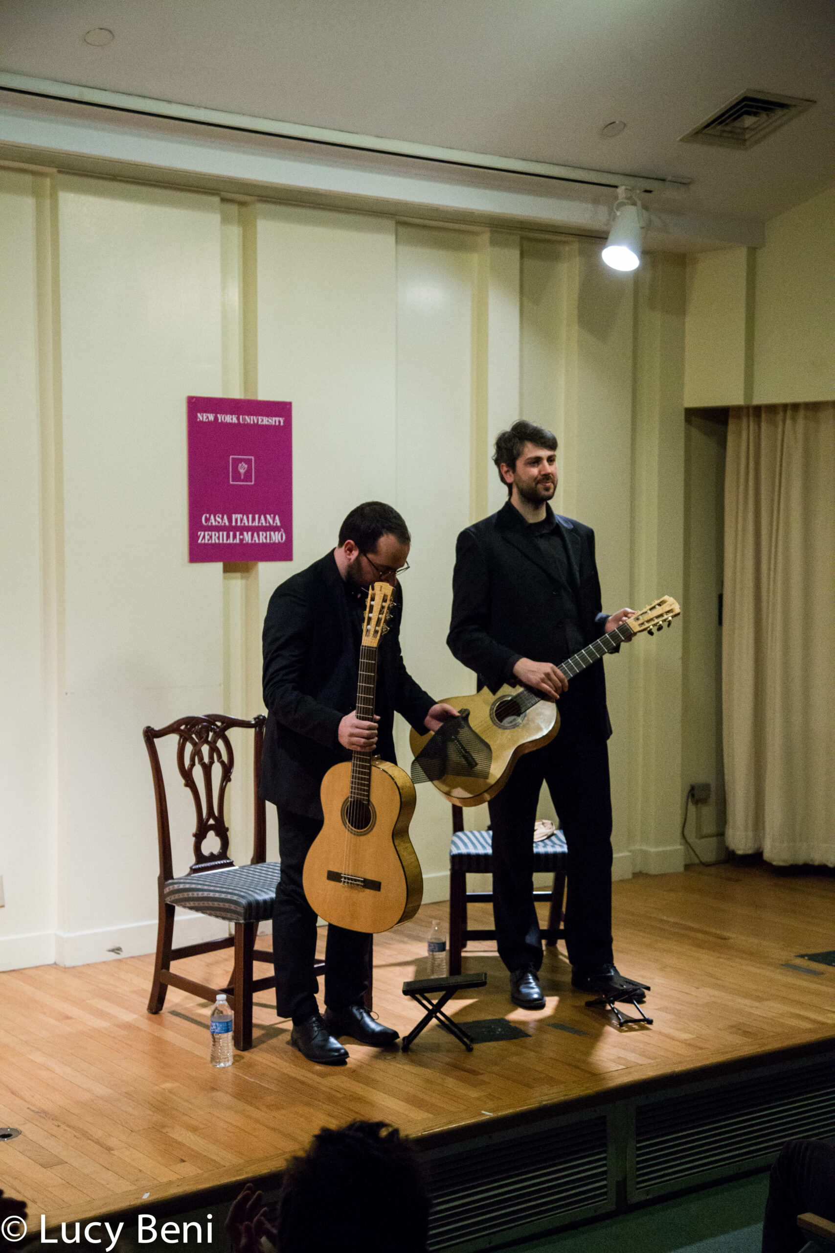 musician-standing-with-guitar-from-concert-duo-scarlatti-guitar-duo-at-casa-italiana