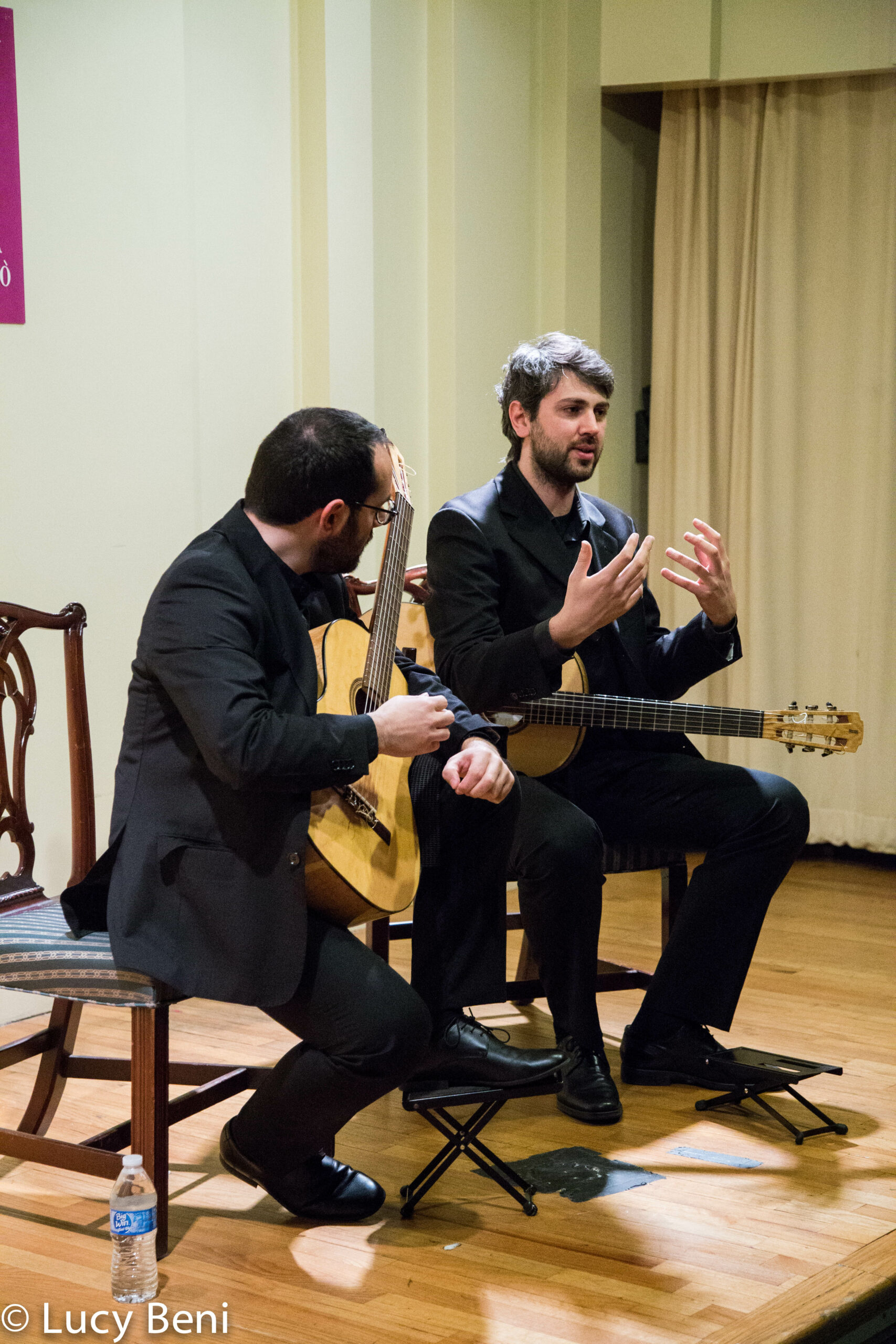 musician-talking-from-concert-duo-scarlatti-guitar-duo-at-casa-italiana