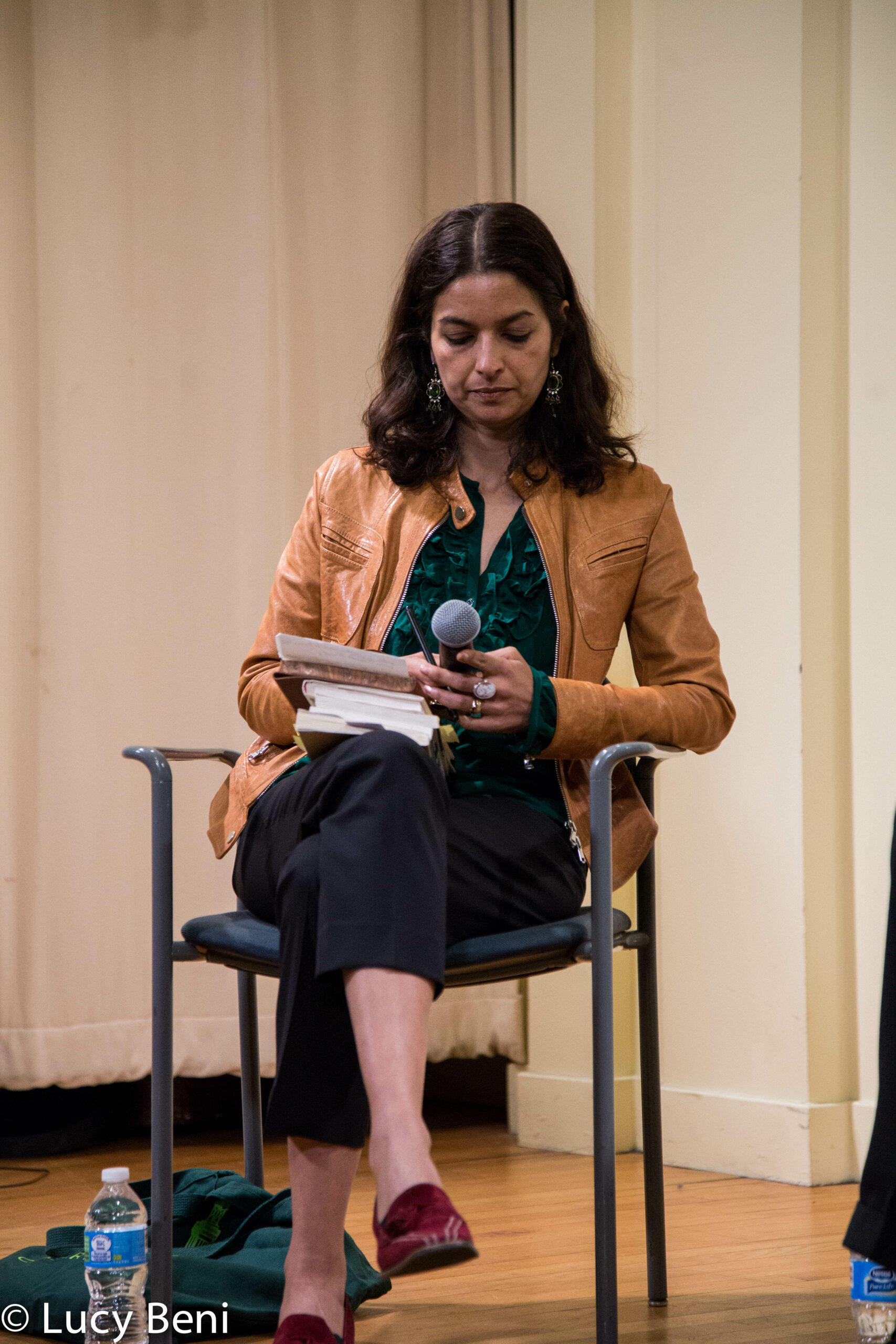 lady-seated-with-mic-from-book-presentation-stories-of-lost-books-at-casa-italiana