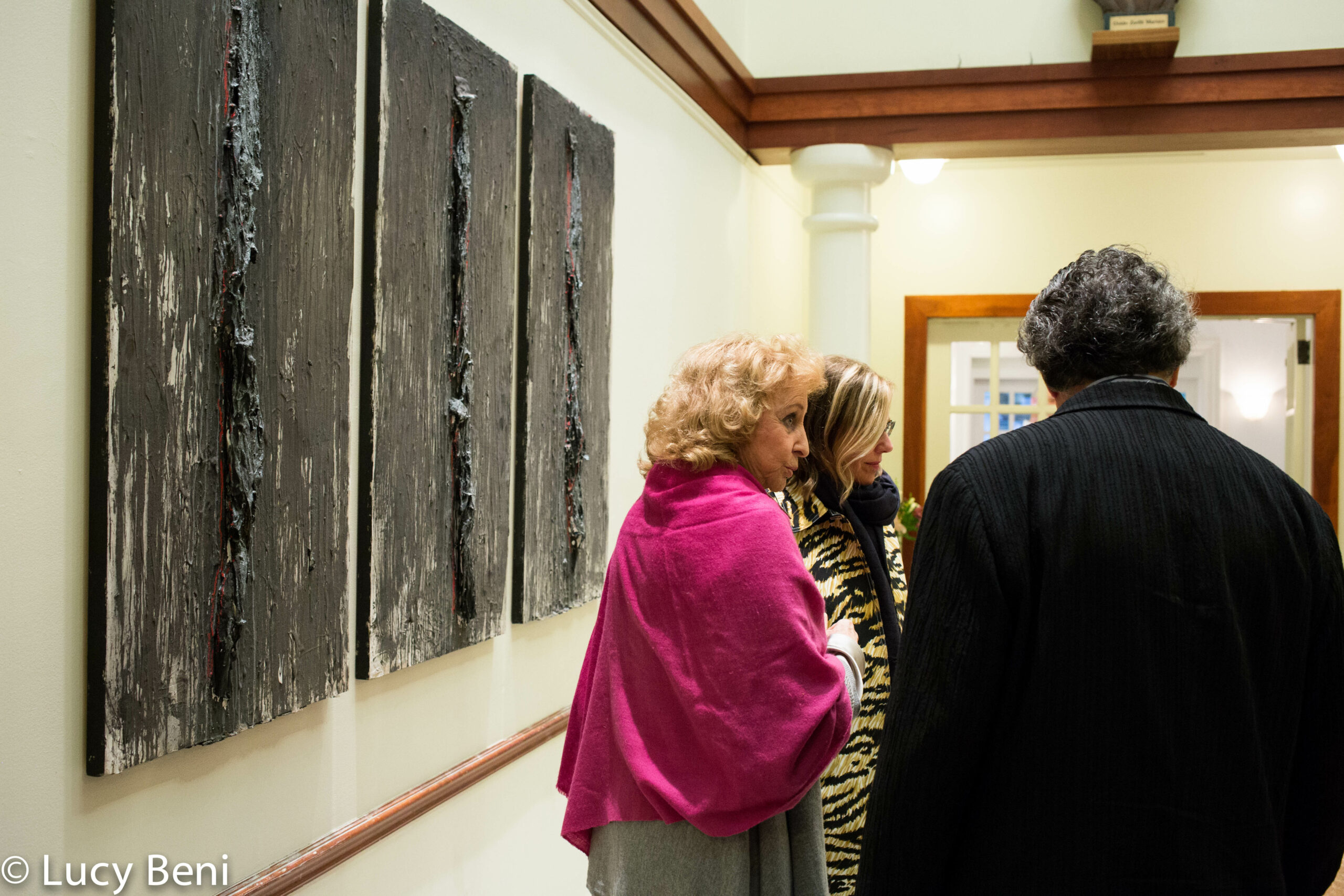 guests-interacting-and-artworks-on-wall-from-exhibition-opening-luisa-gardini-at-casa-italiana