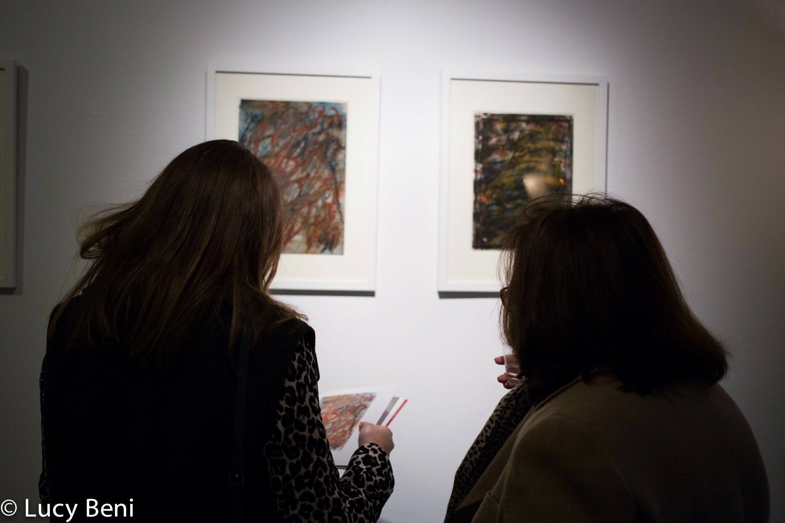 people-watching-artwork-from-exhibition-opening-luisa-gardini-at-casa-italiana
