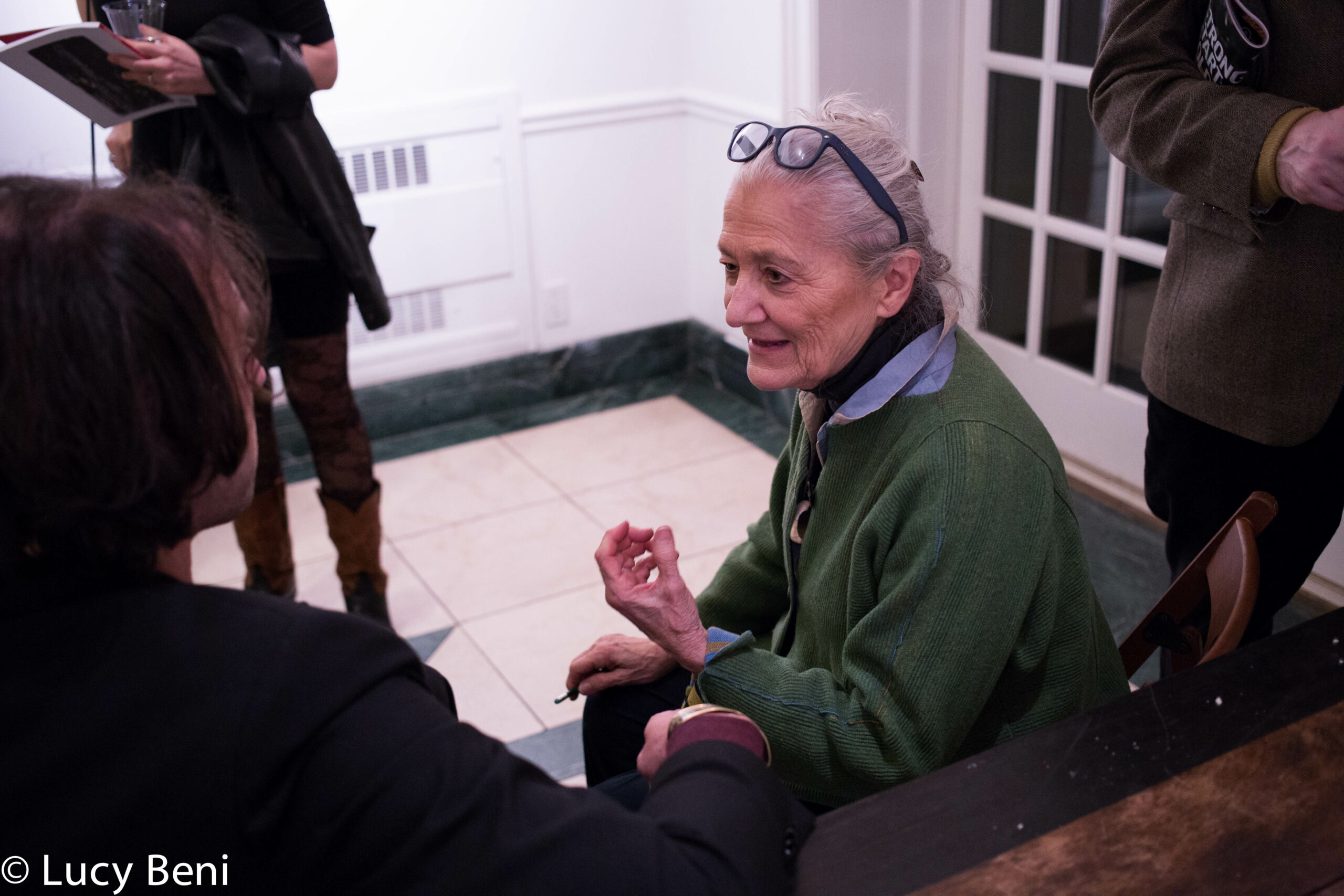 lady-talking-from-exhibition-opening-luisa-gardini-at-casa-italiana