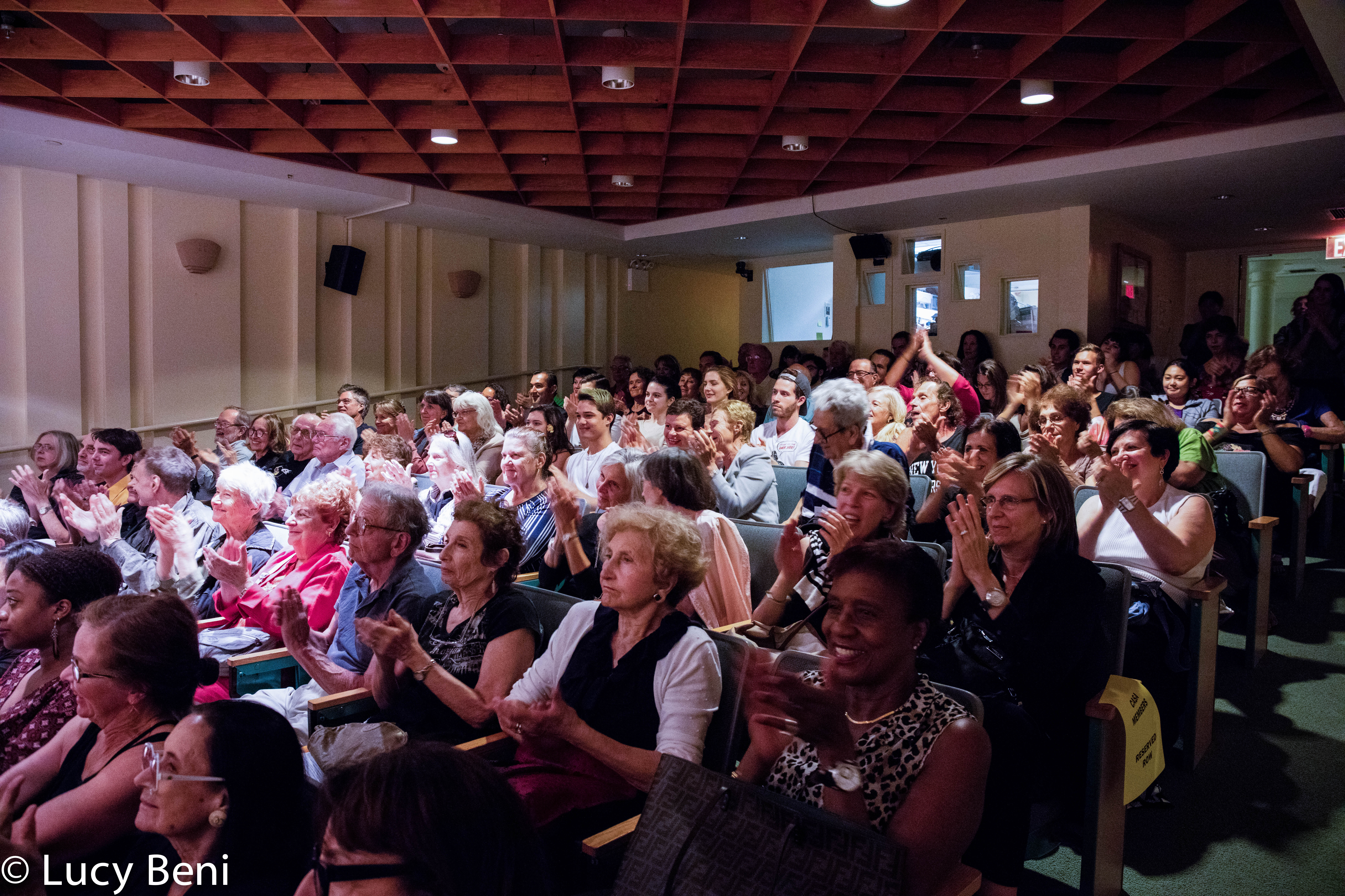 spectators-clapping-from-theatrical-performance-the-misers-daughter-at-casa-italiana