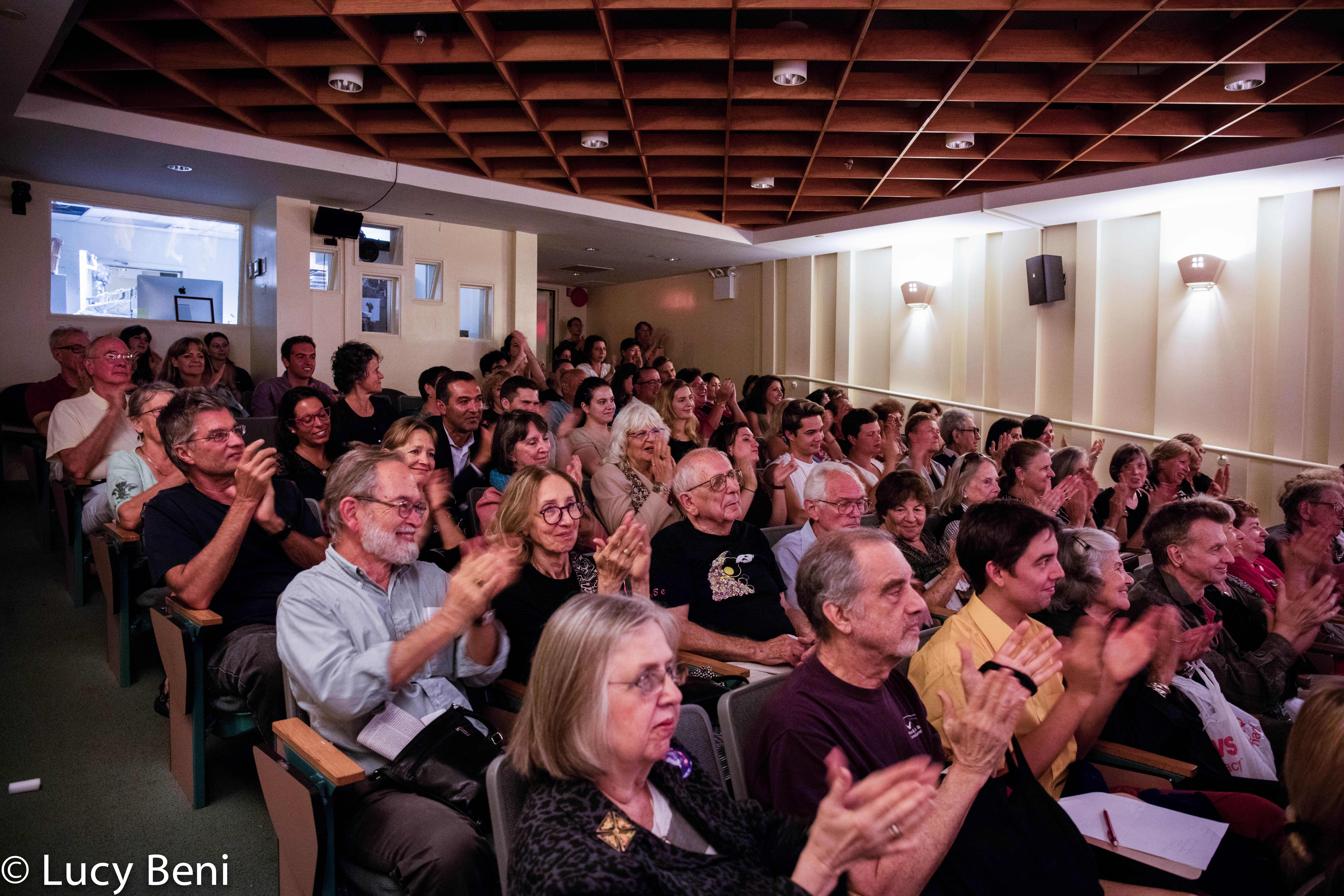 spectators-clapping-from-theatrical-performance-the-misers-daughter-at-casa-italiana