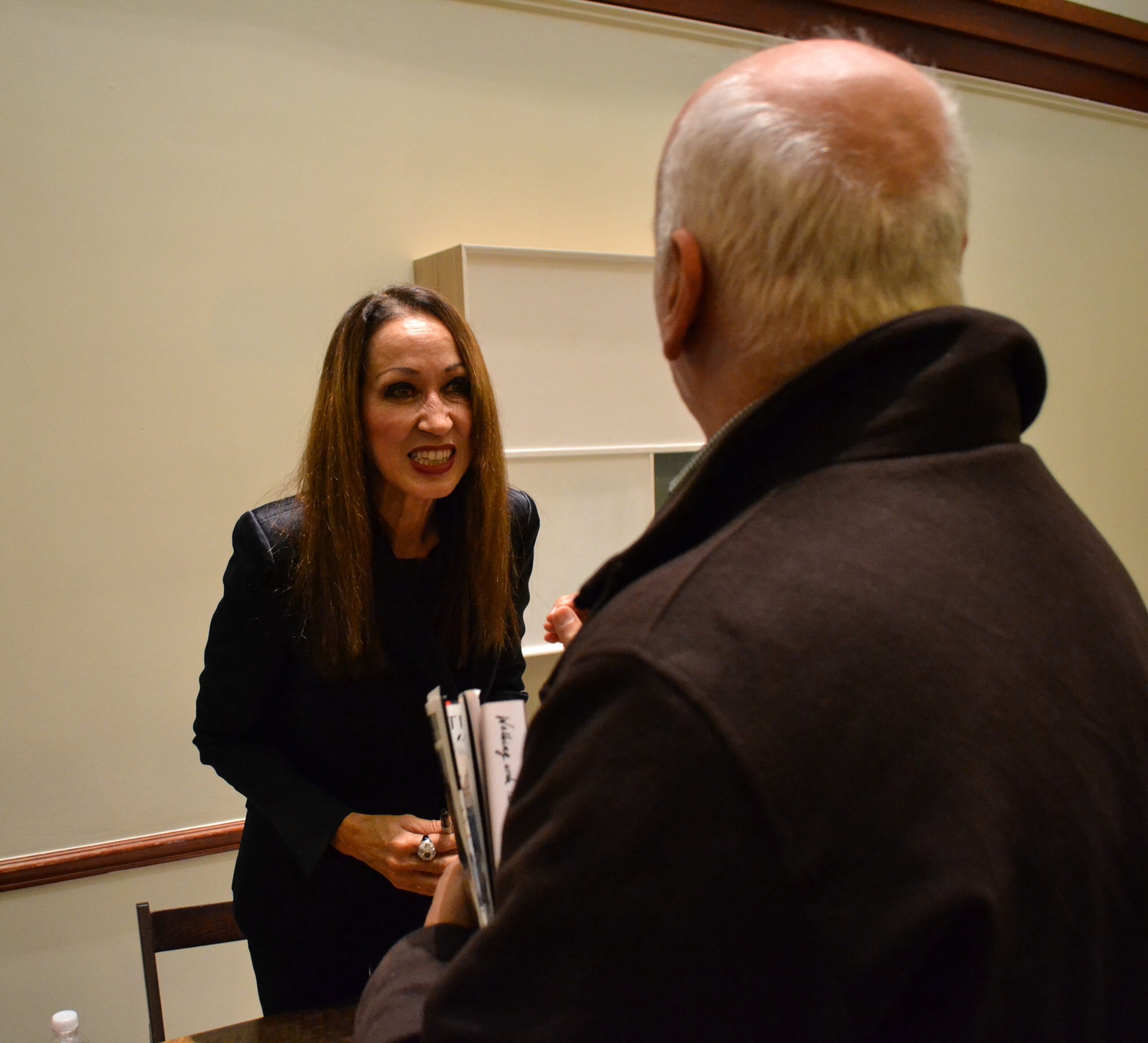 author-interacting-with-guests-from-addressing-style-pat-cleveland-at-casa-italiana
