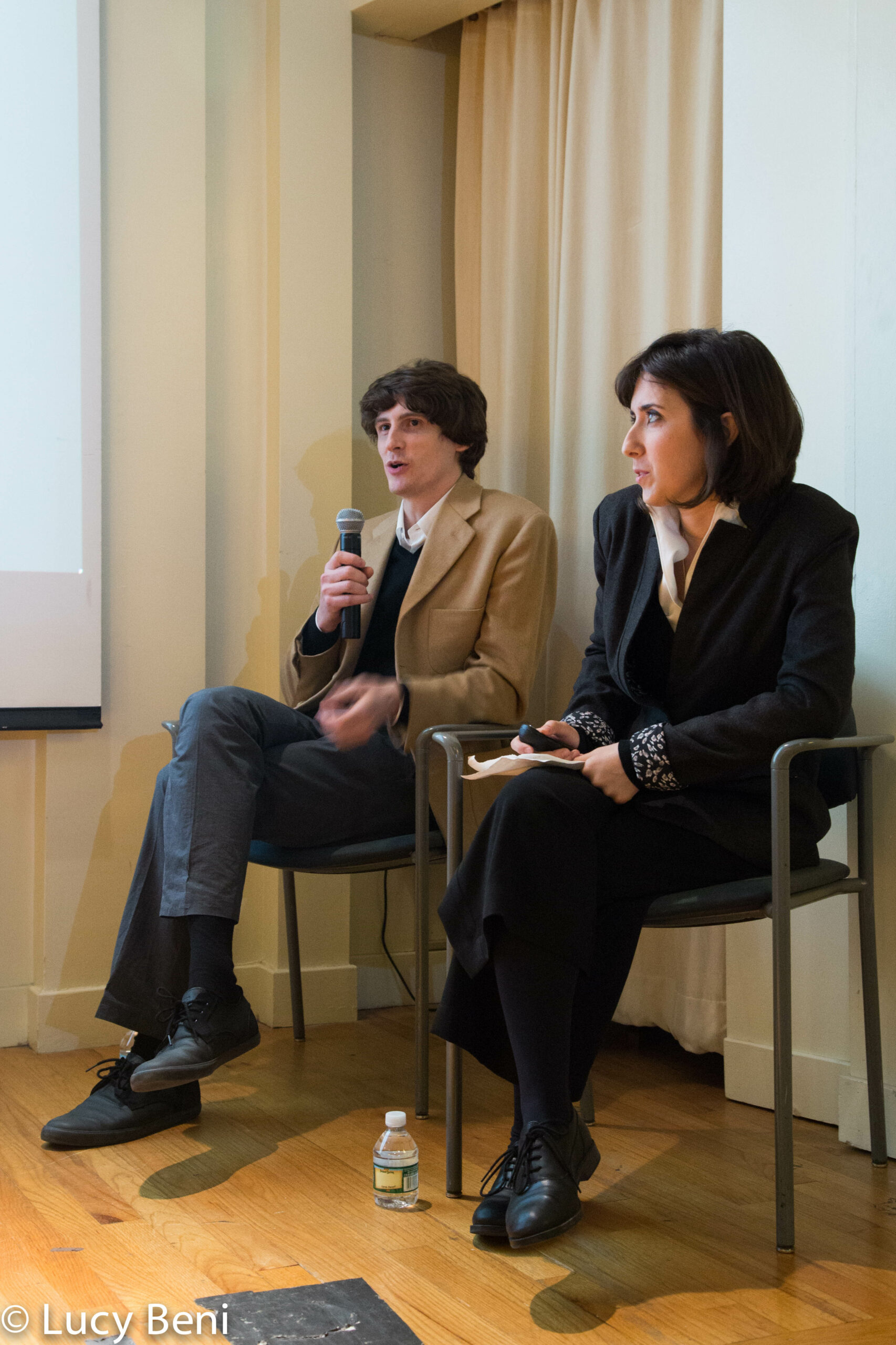 speaker-talking-from-gallery-talk-at-casa-italiana