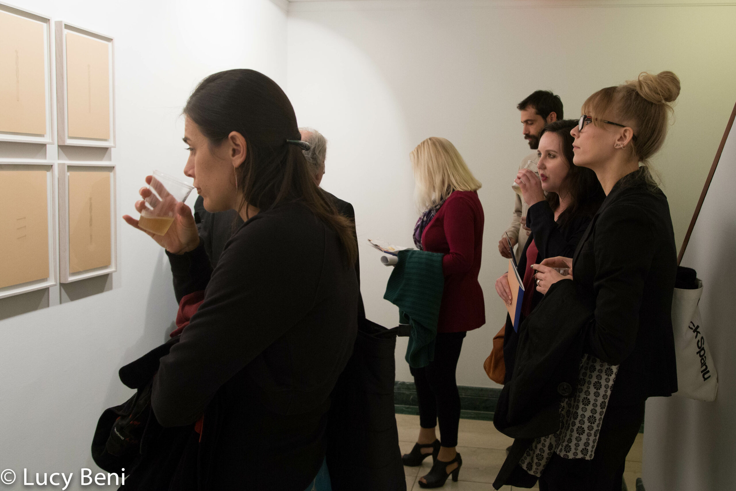 people-seeing-artwork-on-wall-from-gallery-talk-at-casa-italiana