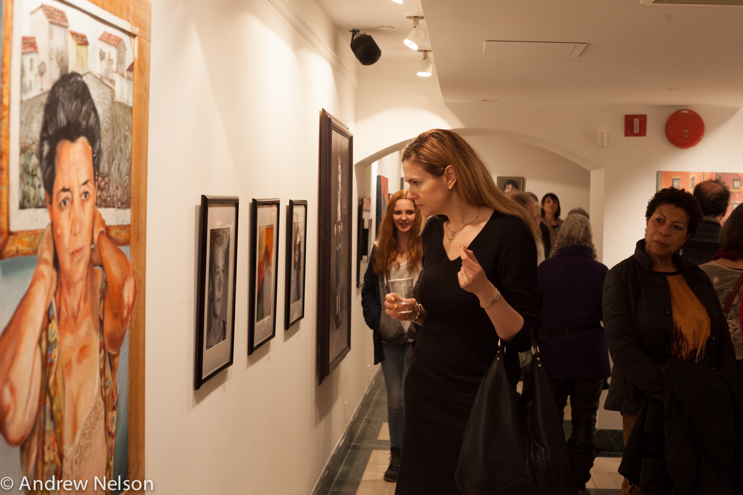 ladies-looking-at-artwork-from-iavanet-exhibition-opening-at-casa-italiana