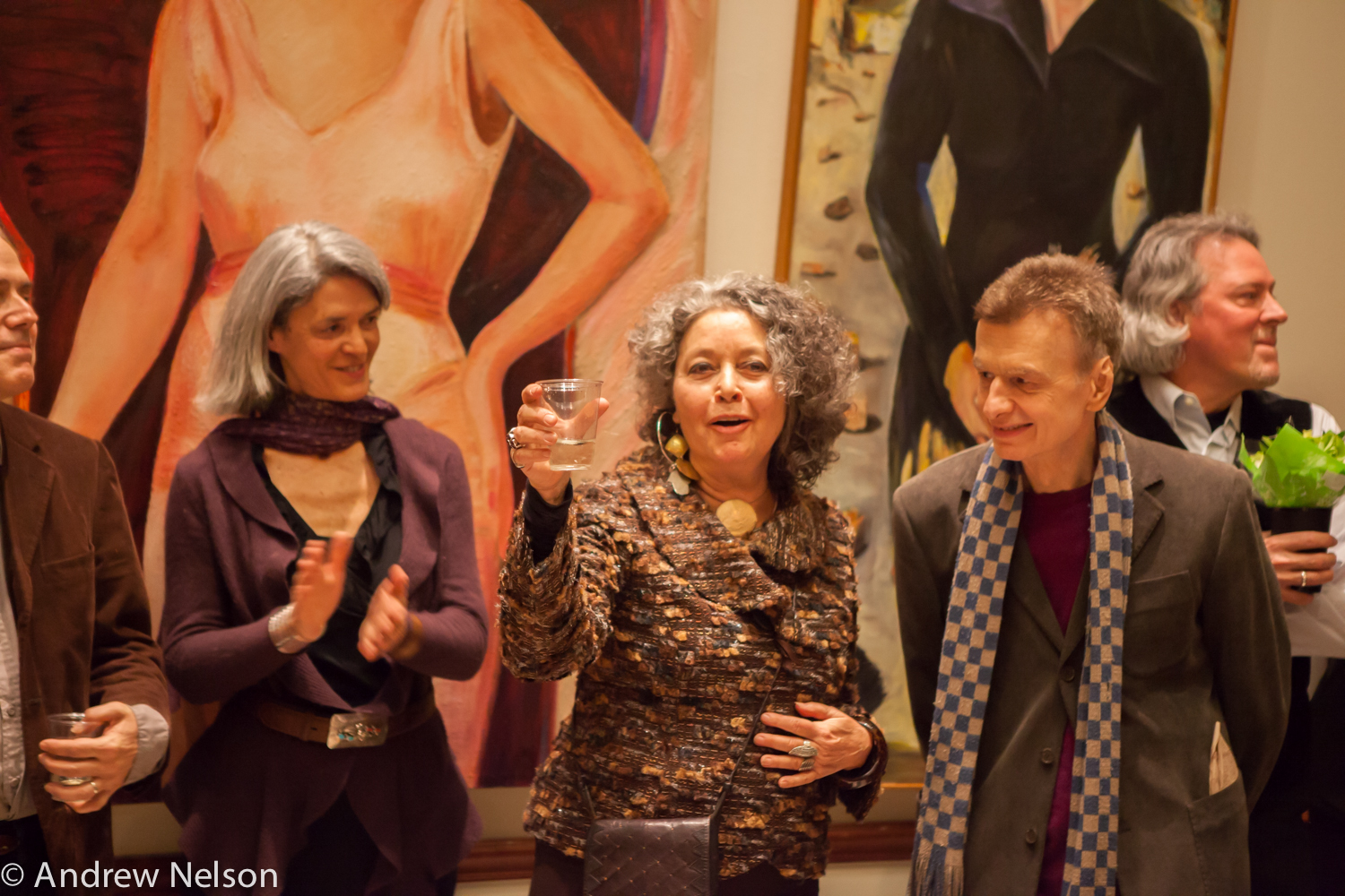 lady-smiling-with-wine-glass-in-hand-from-iavanet-exhibition-opening-at-casa-italiana