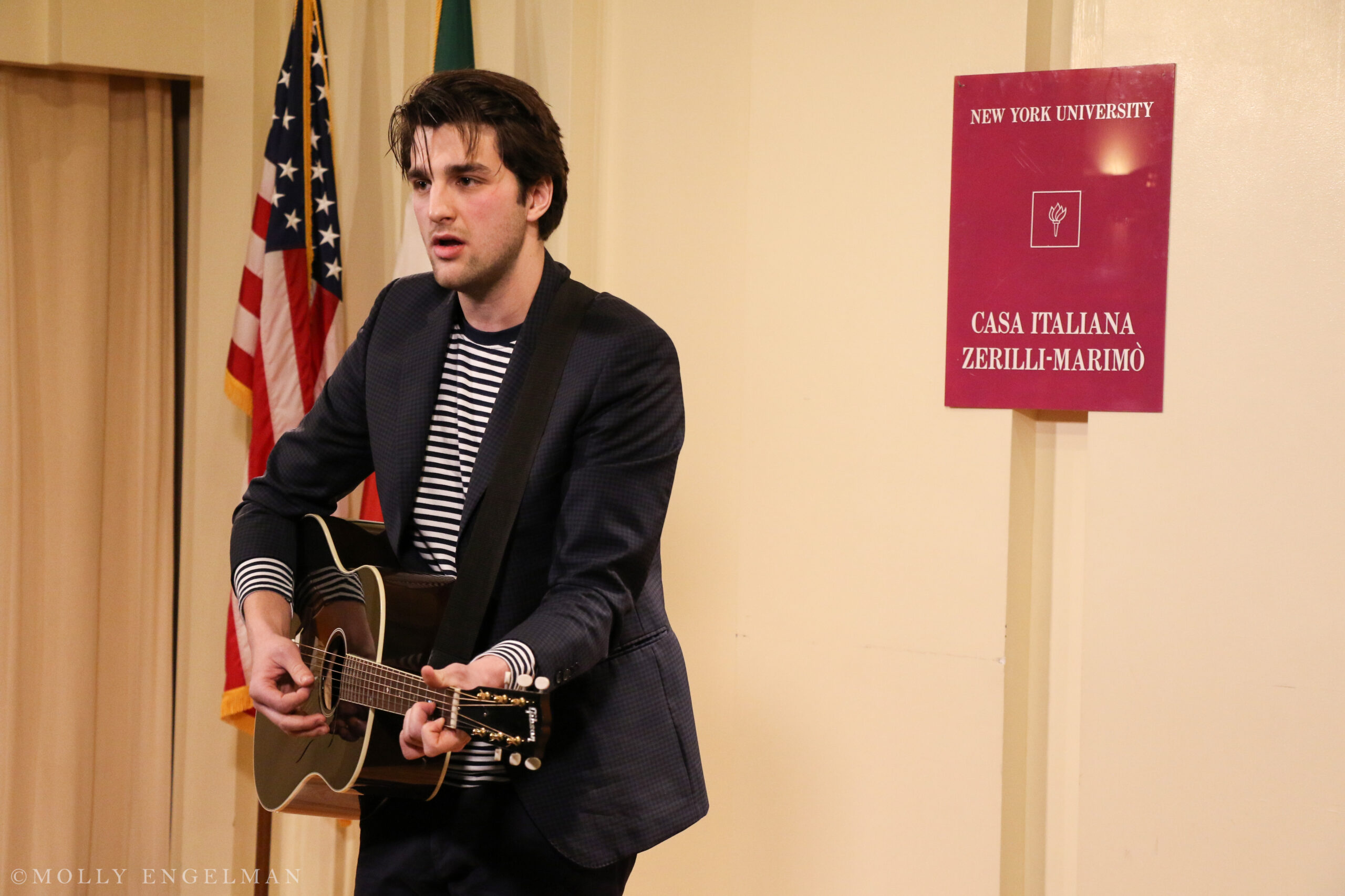 musician-playing-guitar-from-fabio-caninos-rainbow-republic-a-book-presentation-at-casa-italiana