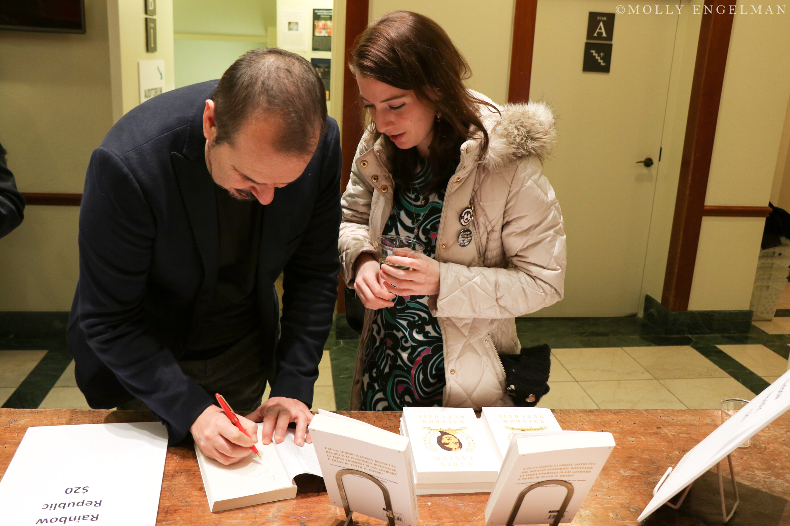 author-signing-book-from-fabio-caninos-rainbow-republic-a-book-presentation-at-casa-italiana