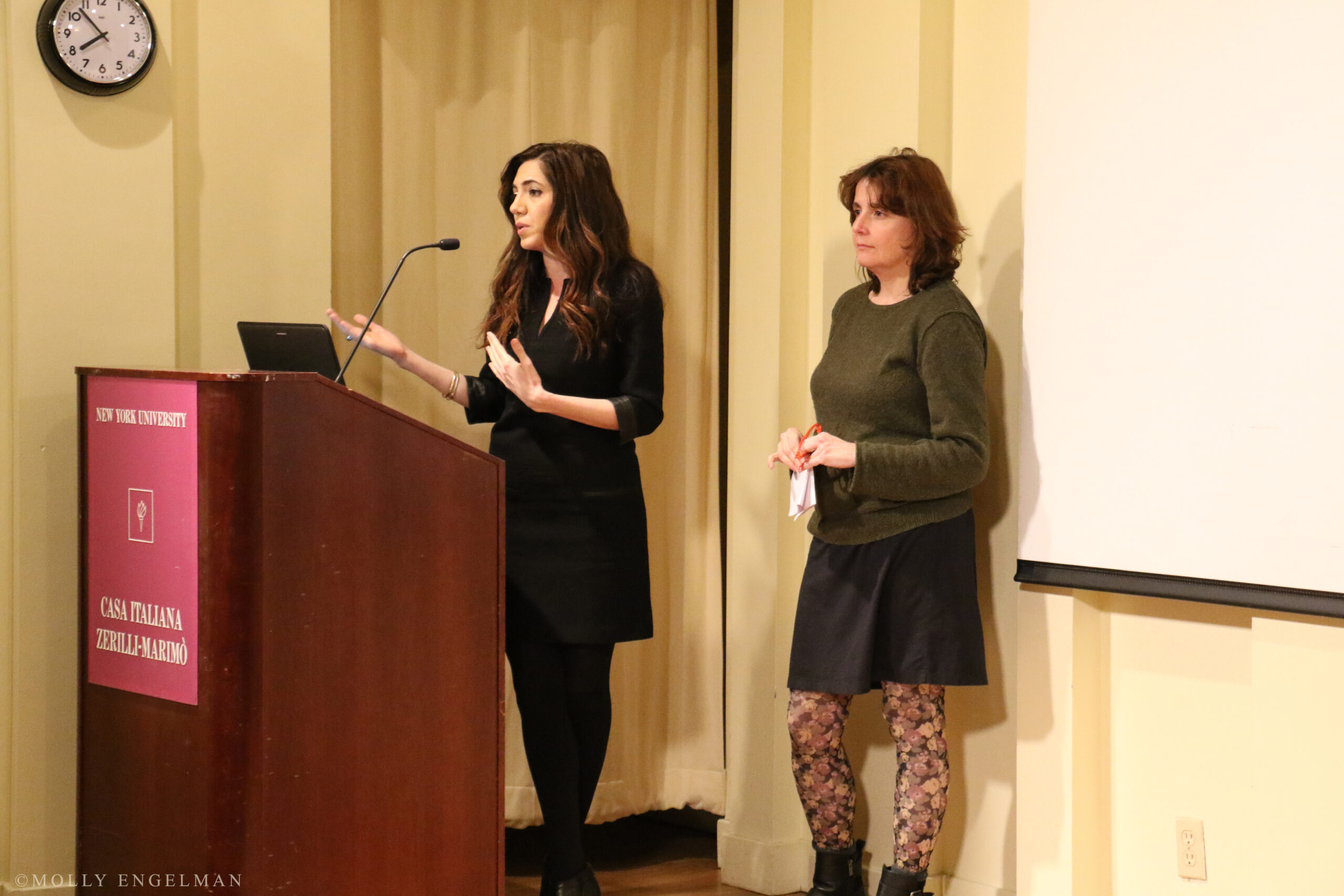 speaker-talking-from-the-triangle-fire-memorial-screening-and-panel-at-casa-italiana