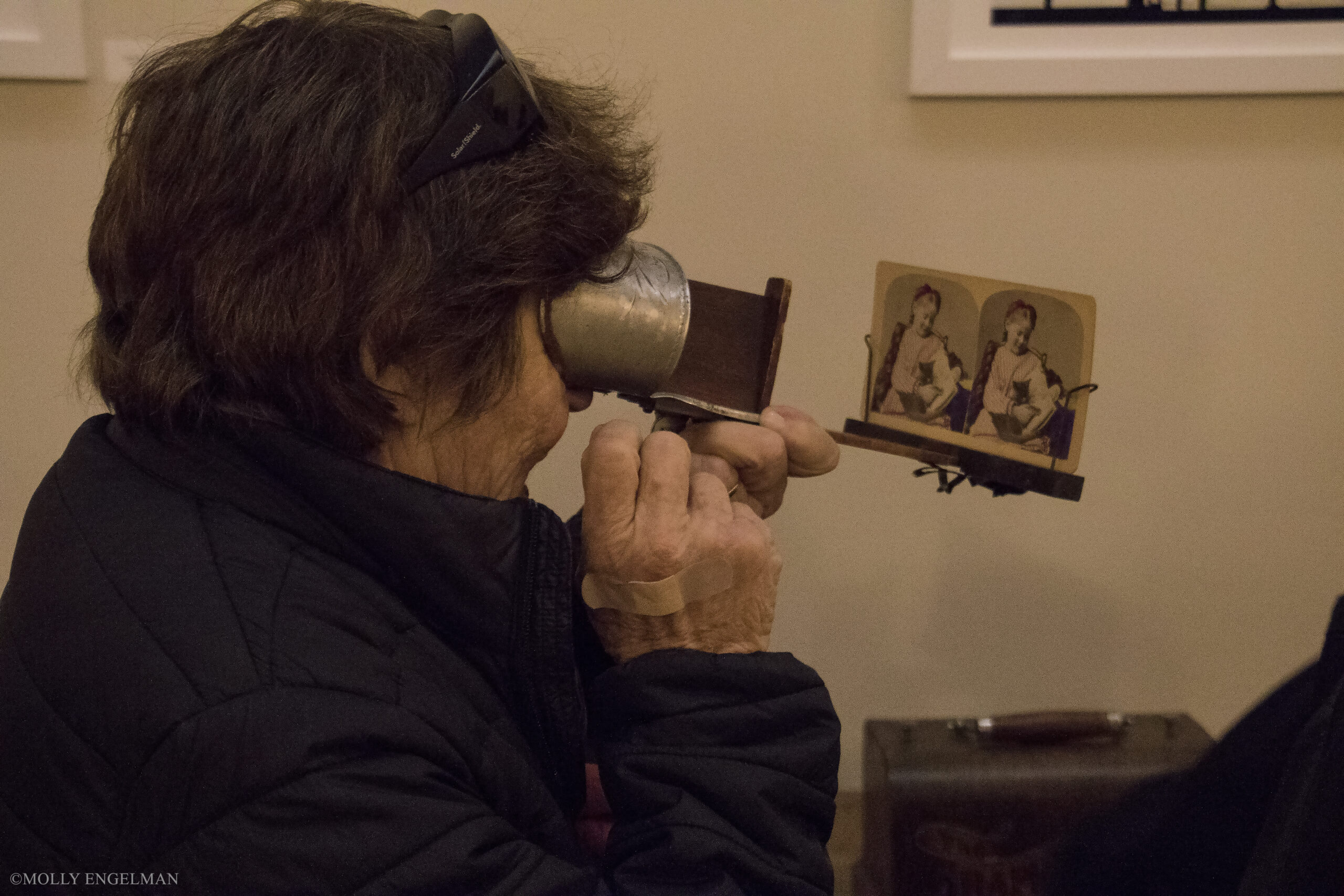 woman-using-binoculars-from-in-scena-italian-theater-festival-ny-at-casa-italiana