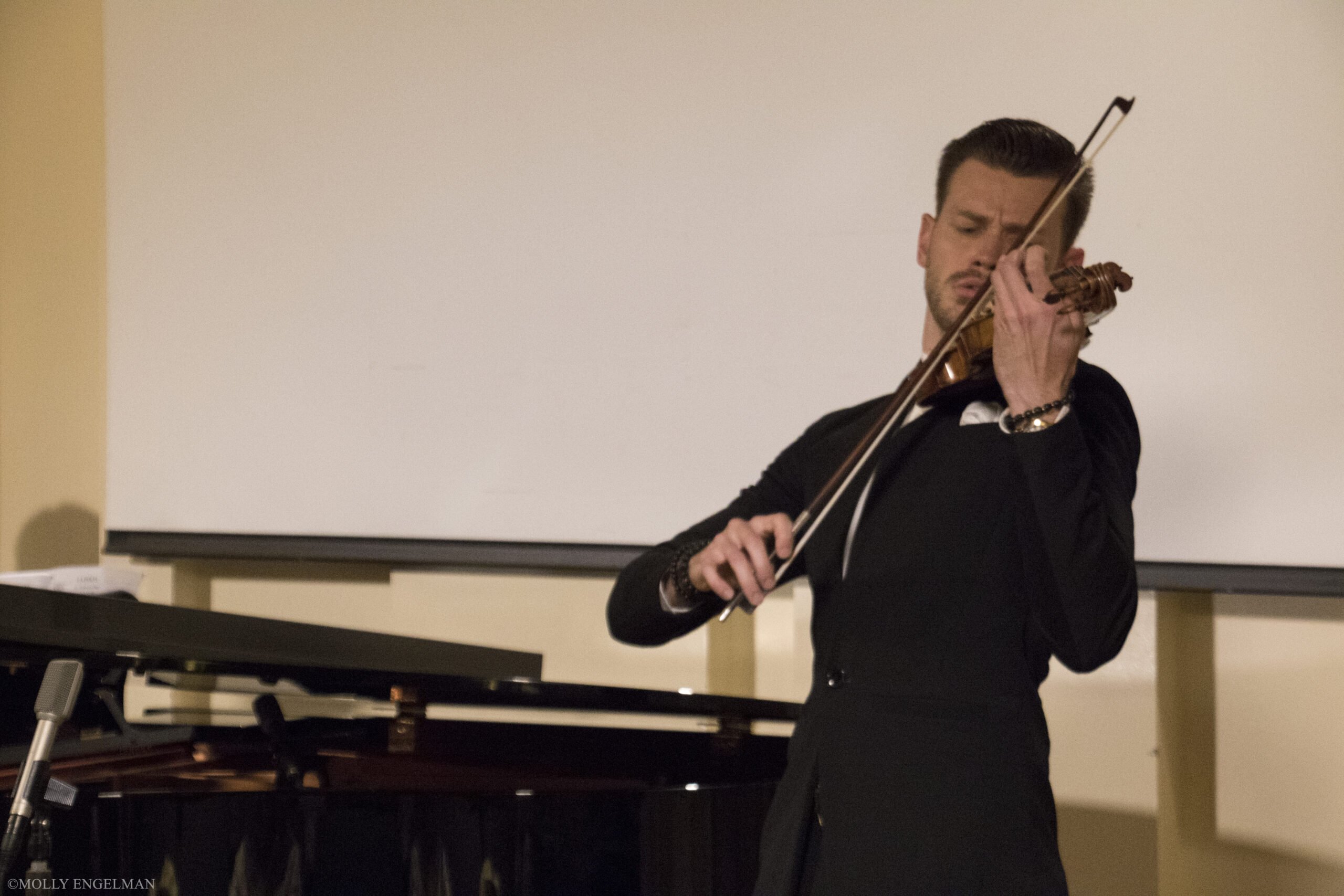 musician-playing-violin-from-chelsea-music-festival-at-casa-italiana