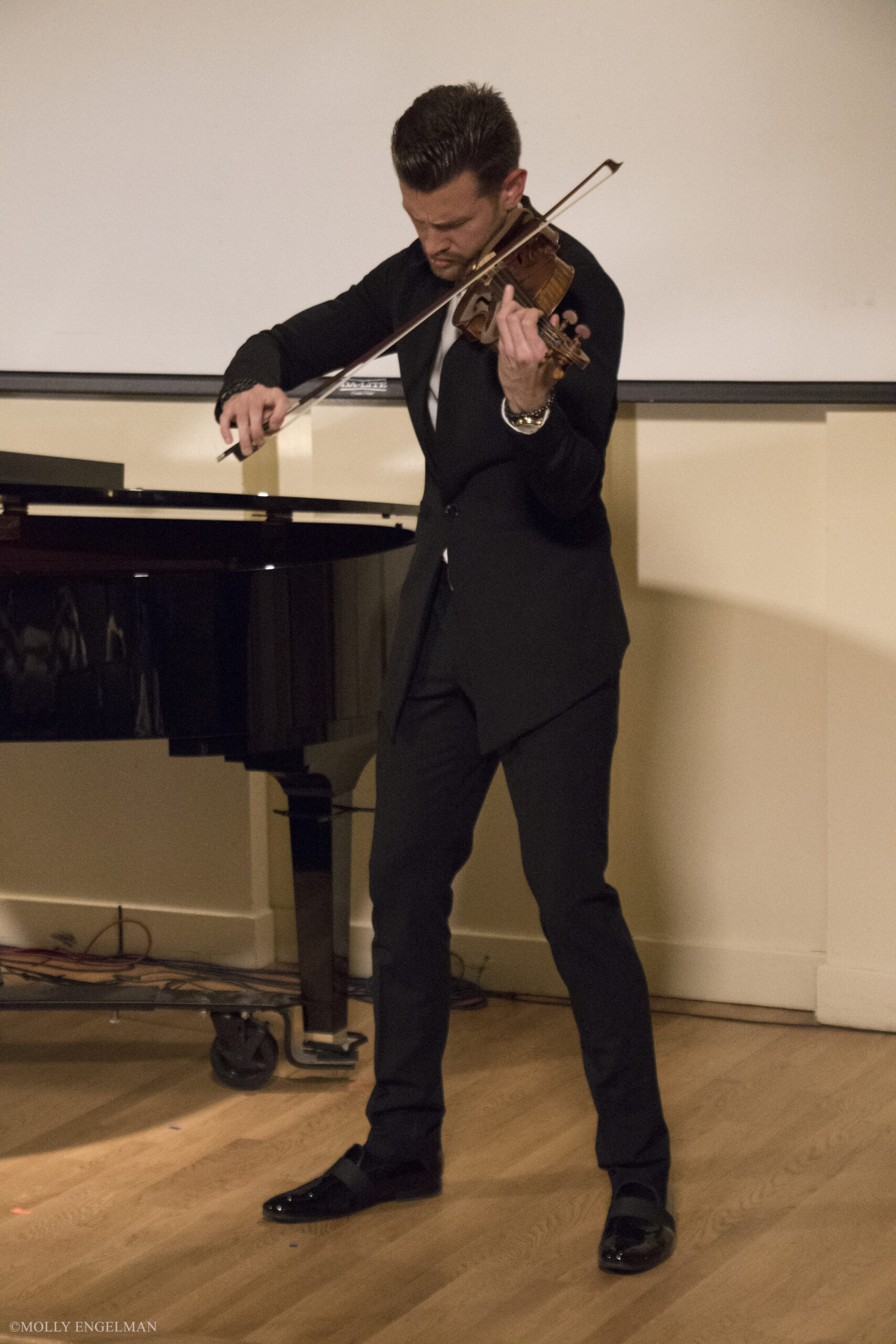 musician-playing-violin-from-chelsea-music-festival-at-casa-italiana