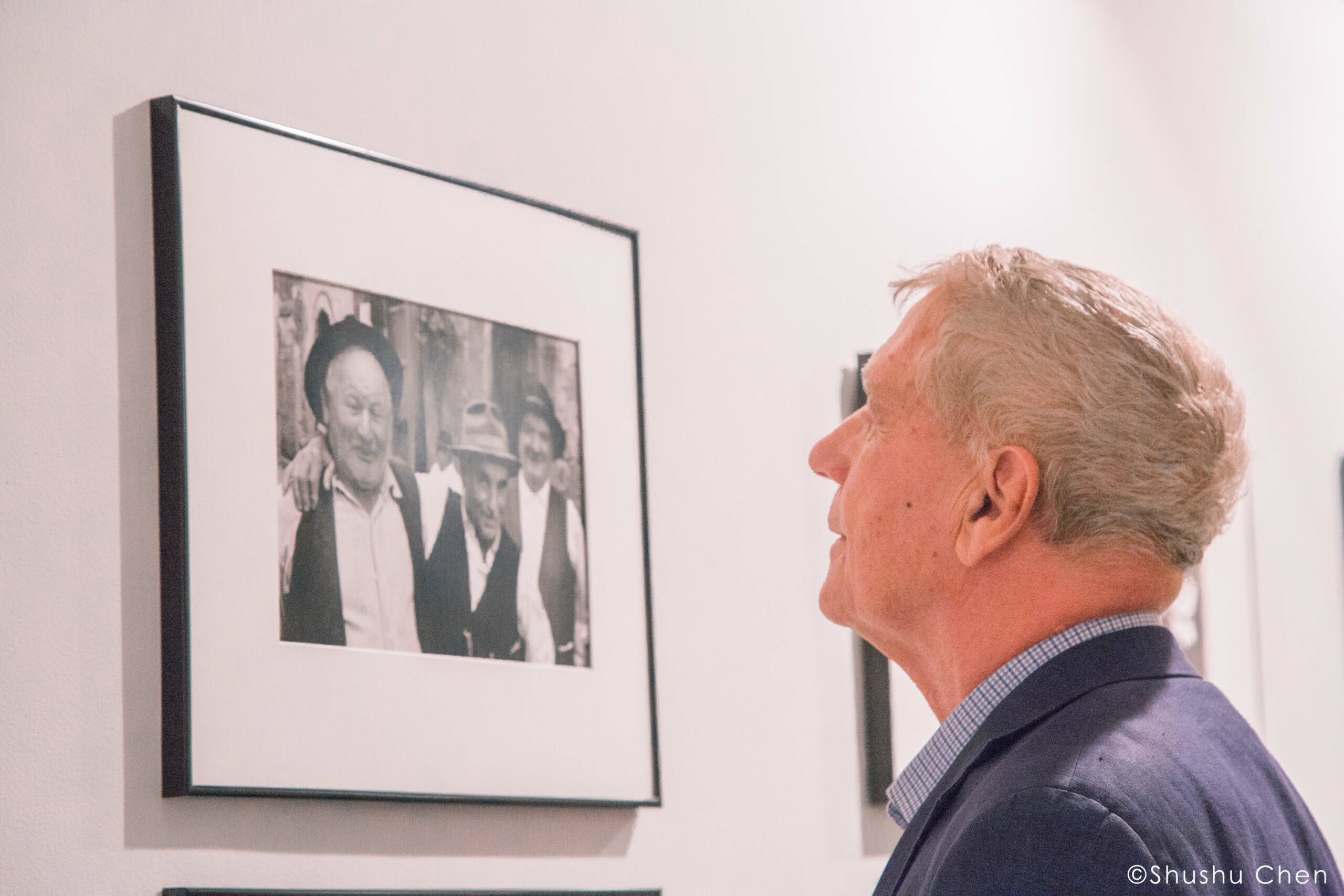 man-seeing-artwork-on-wall-from-exhibition-opening-vintage-italy-1964-at-casa-italiana