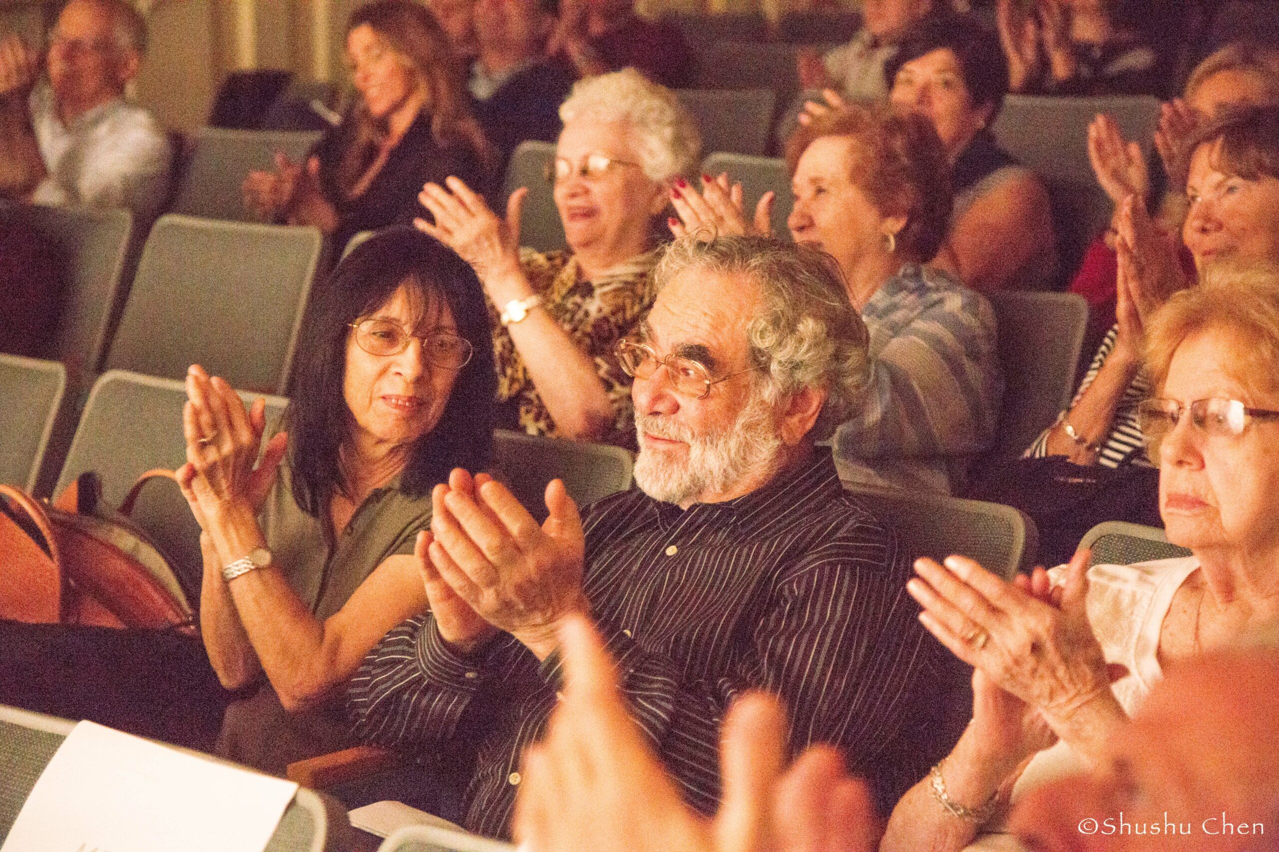 spectators-clapping-from-theatrical-performance-at-casa-italiana
